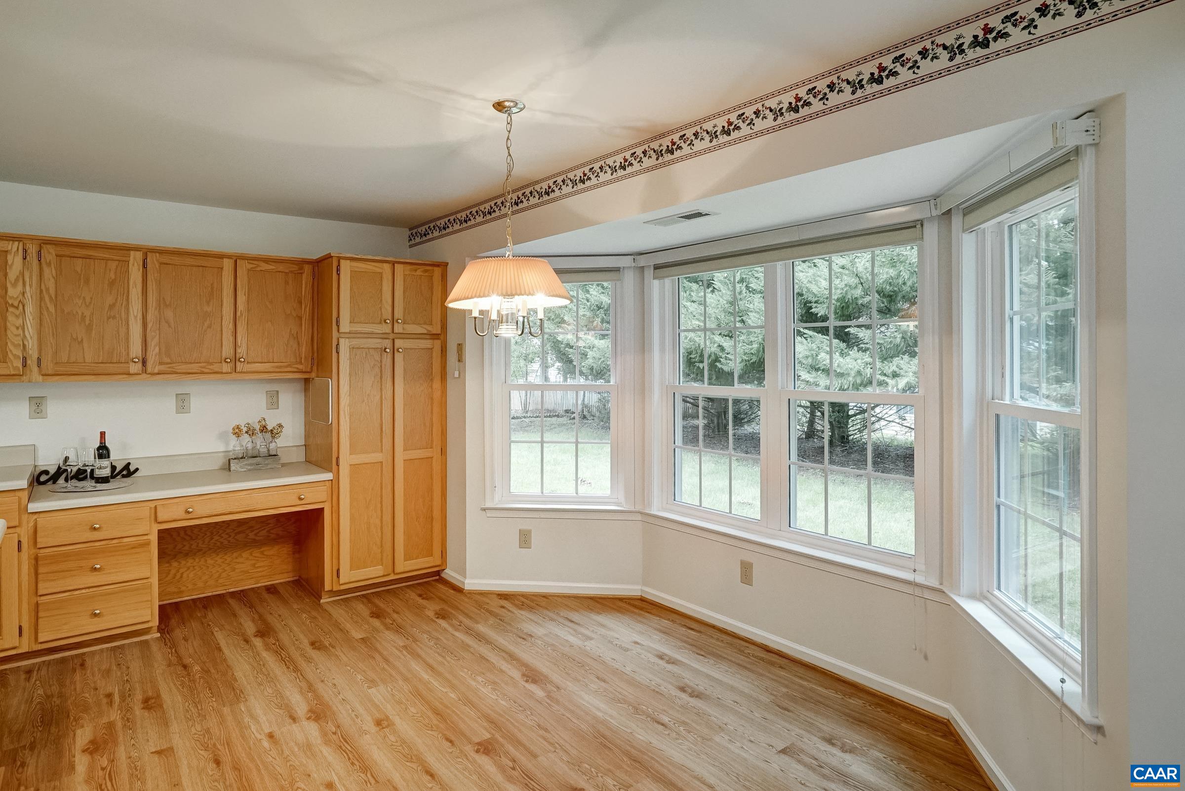 Light-filled breakfast nook with extra storage. Light-filled breakfast nook with extra storage.