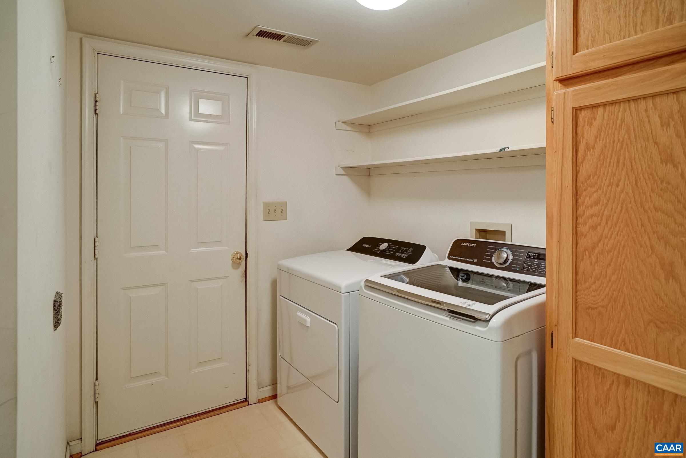 Main level laundry room with extra storage. Main level laundry room with extra storage.