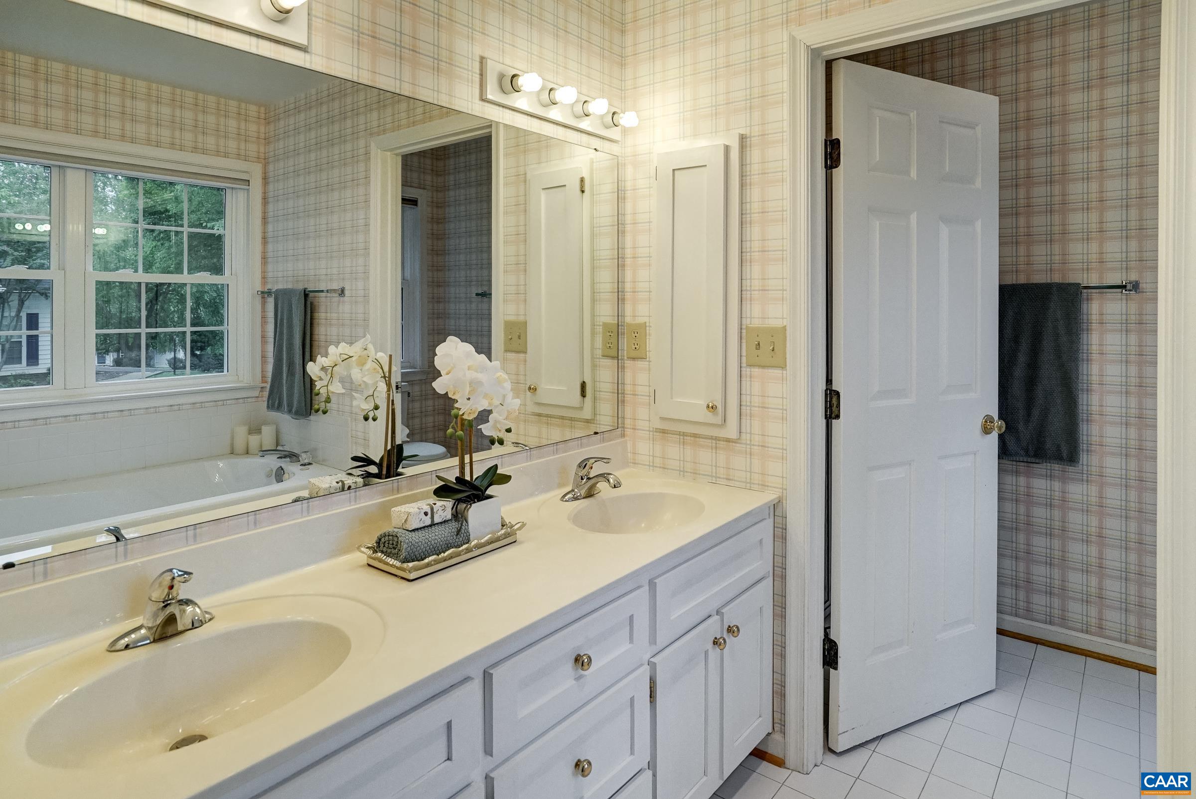 Primary bathroom with double sink vanity. Primary bathroom with double sink vanity.