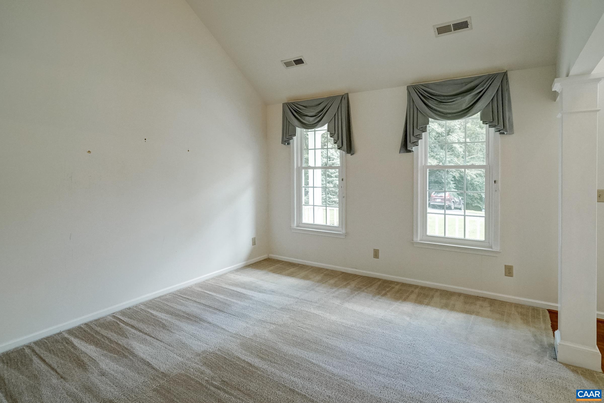 Formal living room with vaulted ceiling to the right as you enter the home. Formal living room with vaulted ceiling to the right as you enter the home.