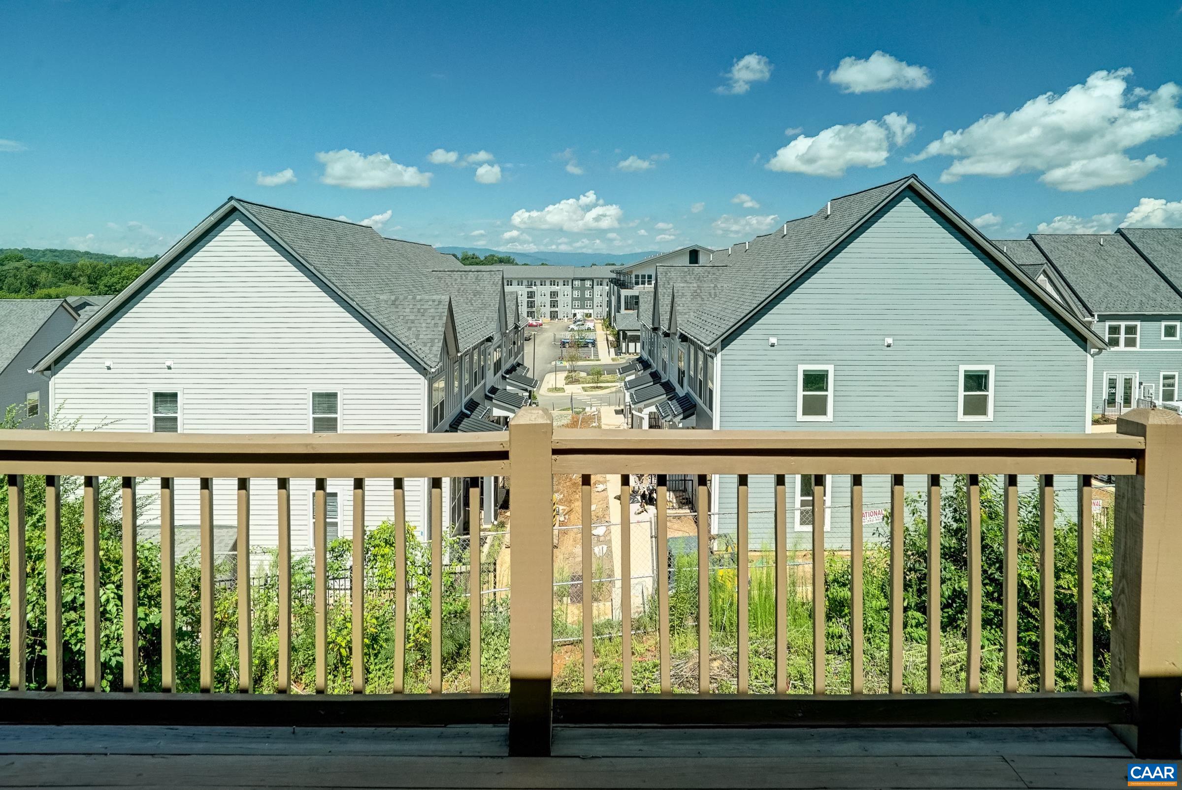 Beautiful deck with sunset views spans rear of home.