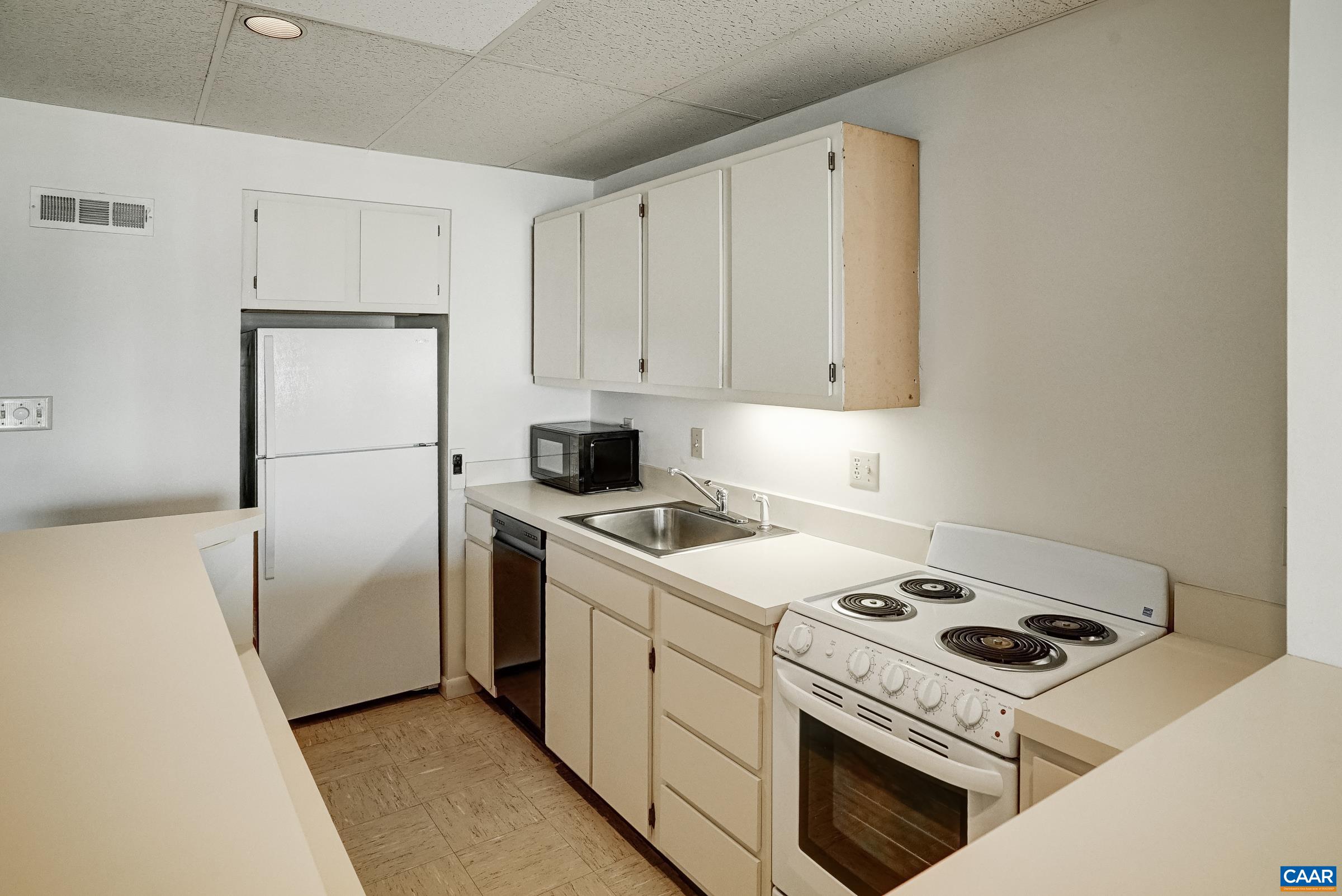 Features refrigerator, range, and dishwasher