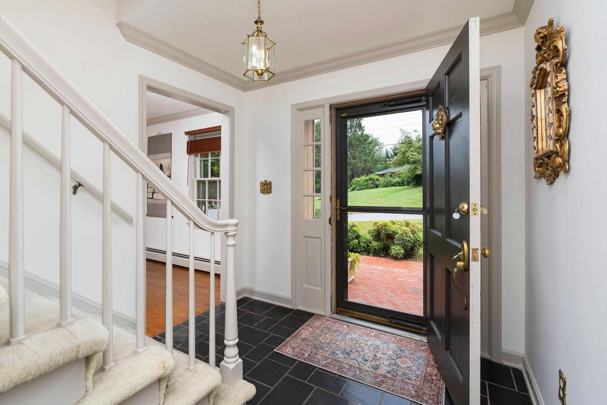...leads one into the Living Room, straight back to the Kitchen, and home office/bedrm #4.