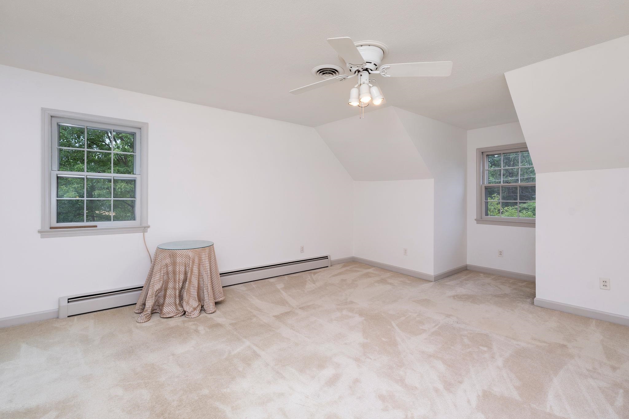 Approximately 15'11 X 14'. (Attic storage access from the window alcove.)
