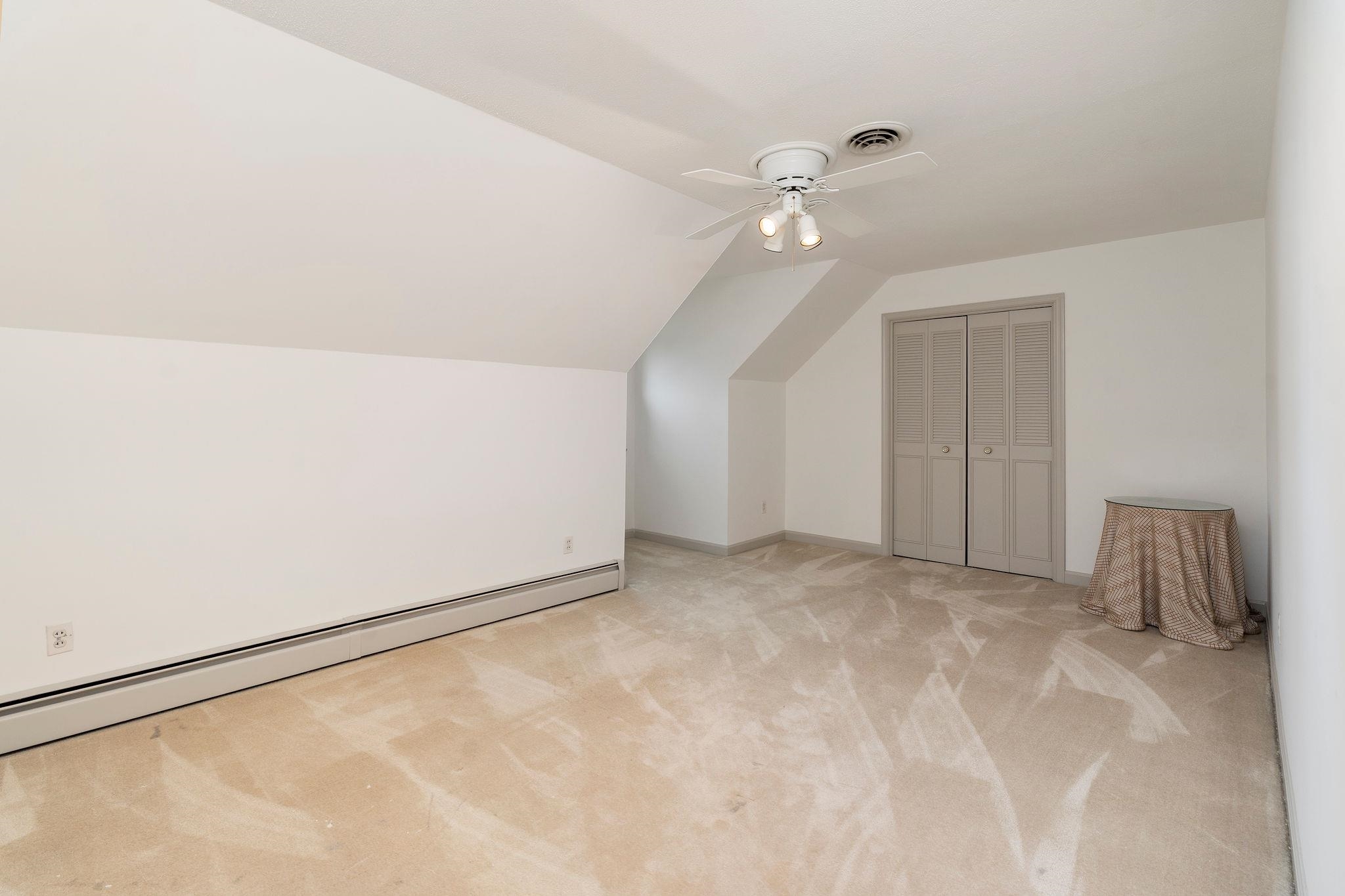 Approx. 18'11 X 10'11. (Attic storage access within the window alcove.)