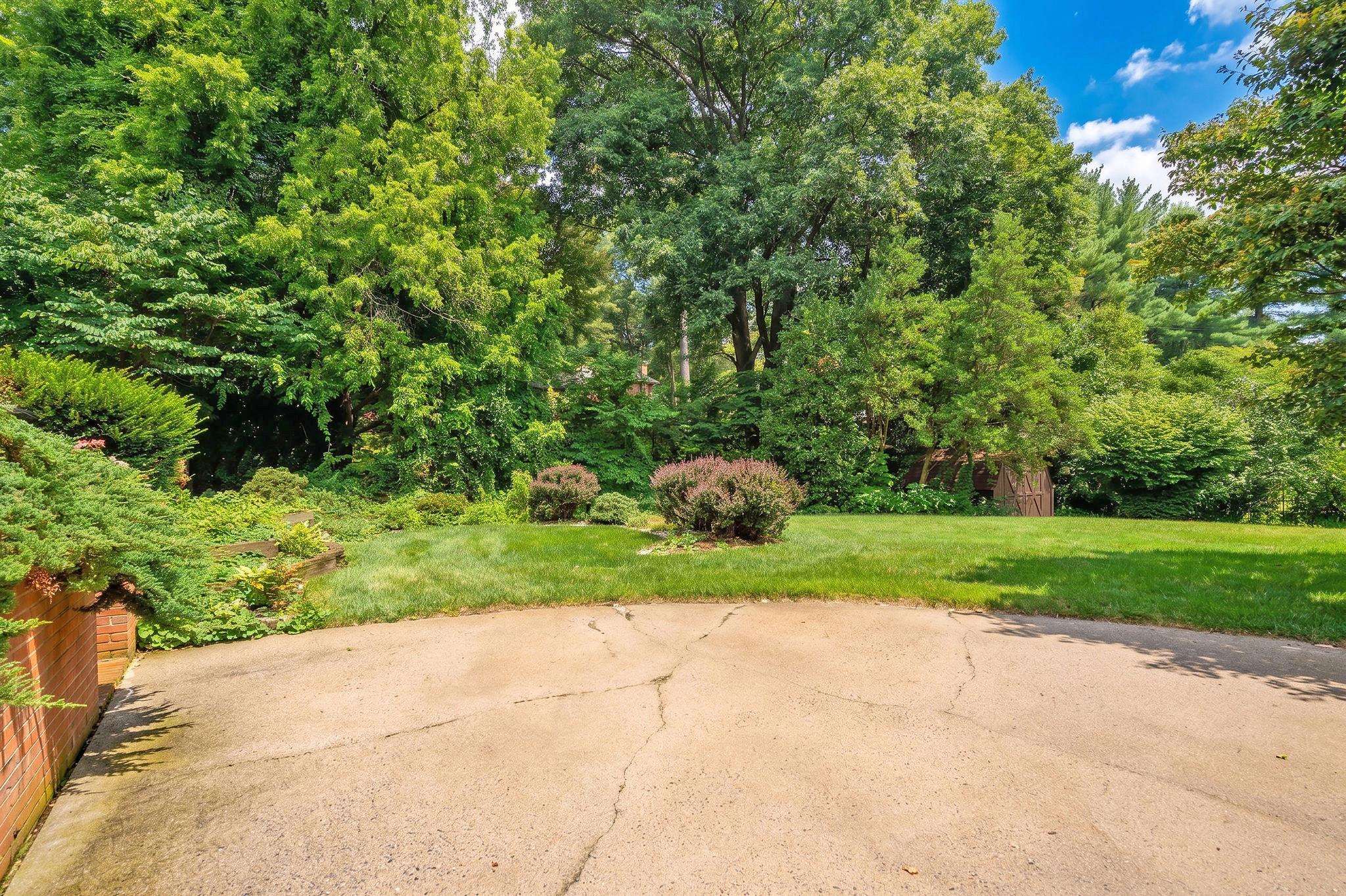 ...surrounded with mature trees and landscaping.