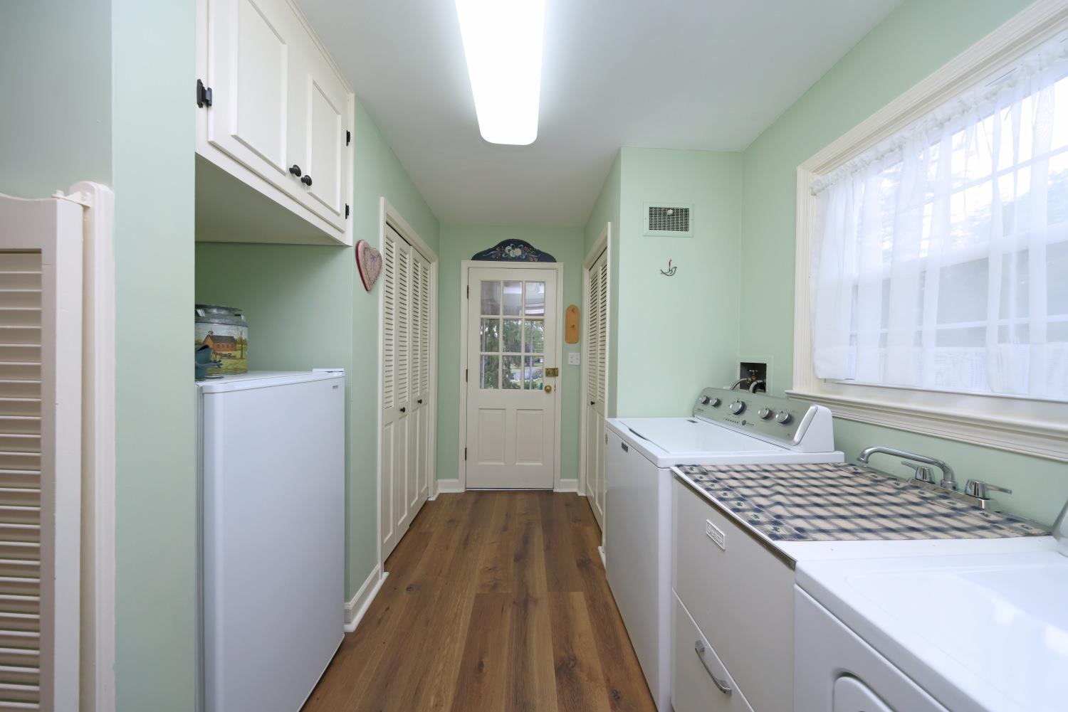 Leads from the kitchen to the screened in porch Leads from the kitchen to the screened in porch