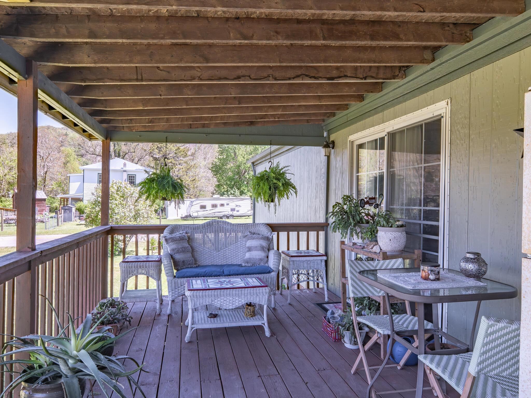 A small covered front porch and a larger covered rear porch provide inviting outdoor areas. A small covered front porch and a larger covered rear porch provide inviting outdoor areas.