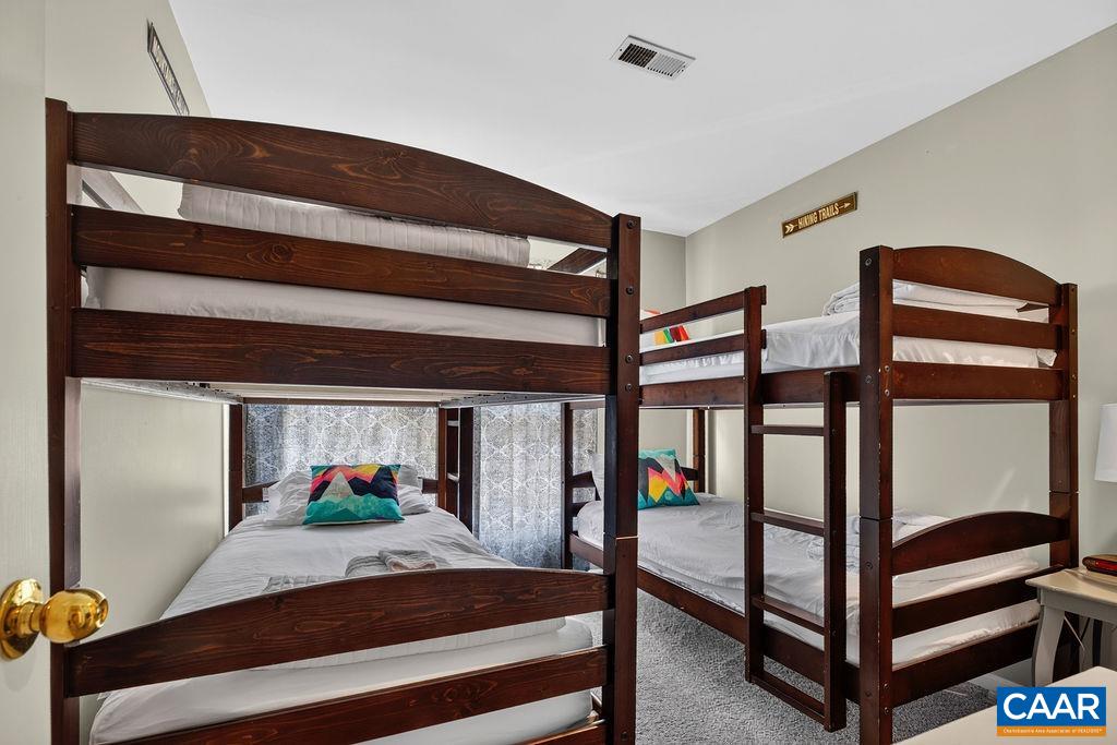 One of the two guest bedrooms on the second floor.