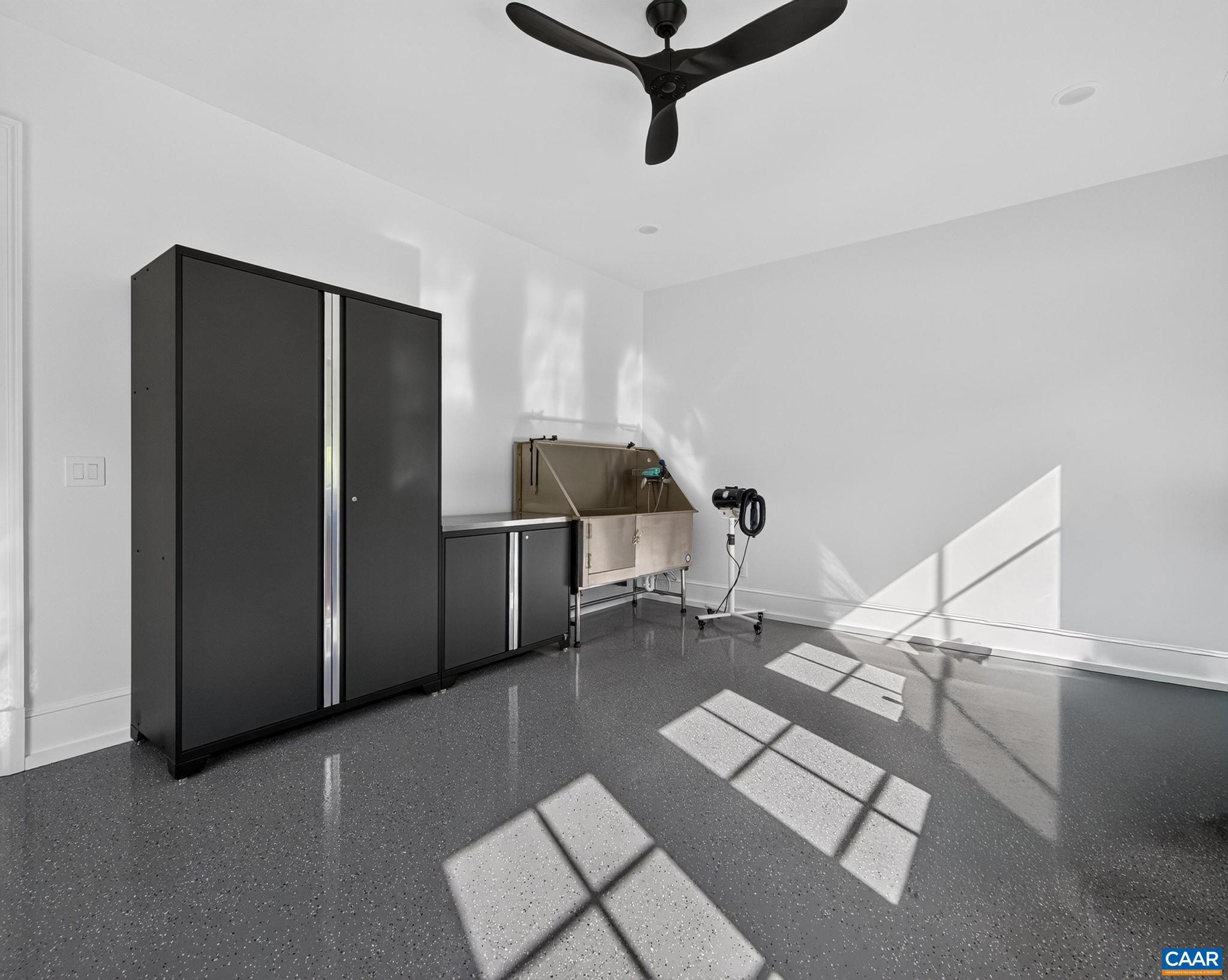 Large, conditioned room with epoxy floors for pool accessory storage, dog washing station Large, conditioned room with epoxy floors for pool accessory storage, dog washing station