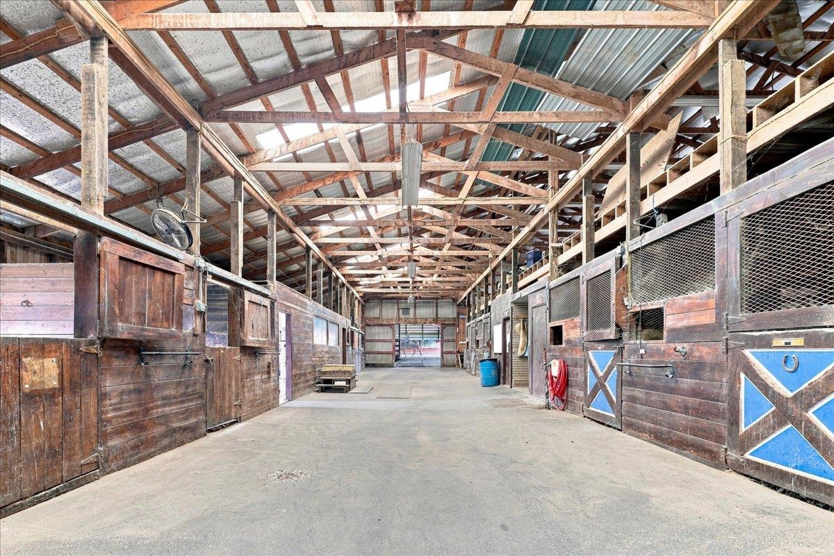 40-stall stable with wood post-and-beam construction, metal roof, rubber-matted stalls, office, laundry, bathroom, wash racks, tack rooms and loft storage. Includes a 3-bedroom apartment with kitchen, bath and living area. 40-stall stable with wood post-and-beam construction, metal roof, rubber-matted stalls, office, laundry, bathroom, wash racks, tack rooms and loft storage. Includes a 3-bedroom apartment with kitchen, bath and living area.