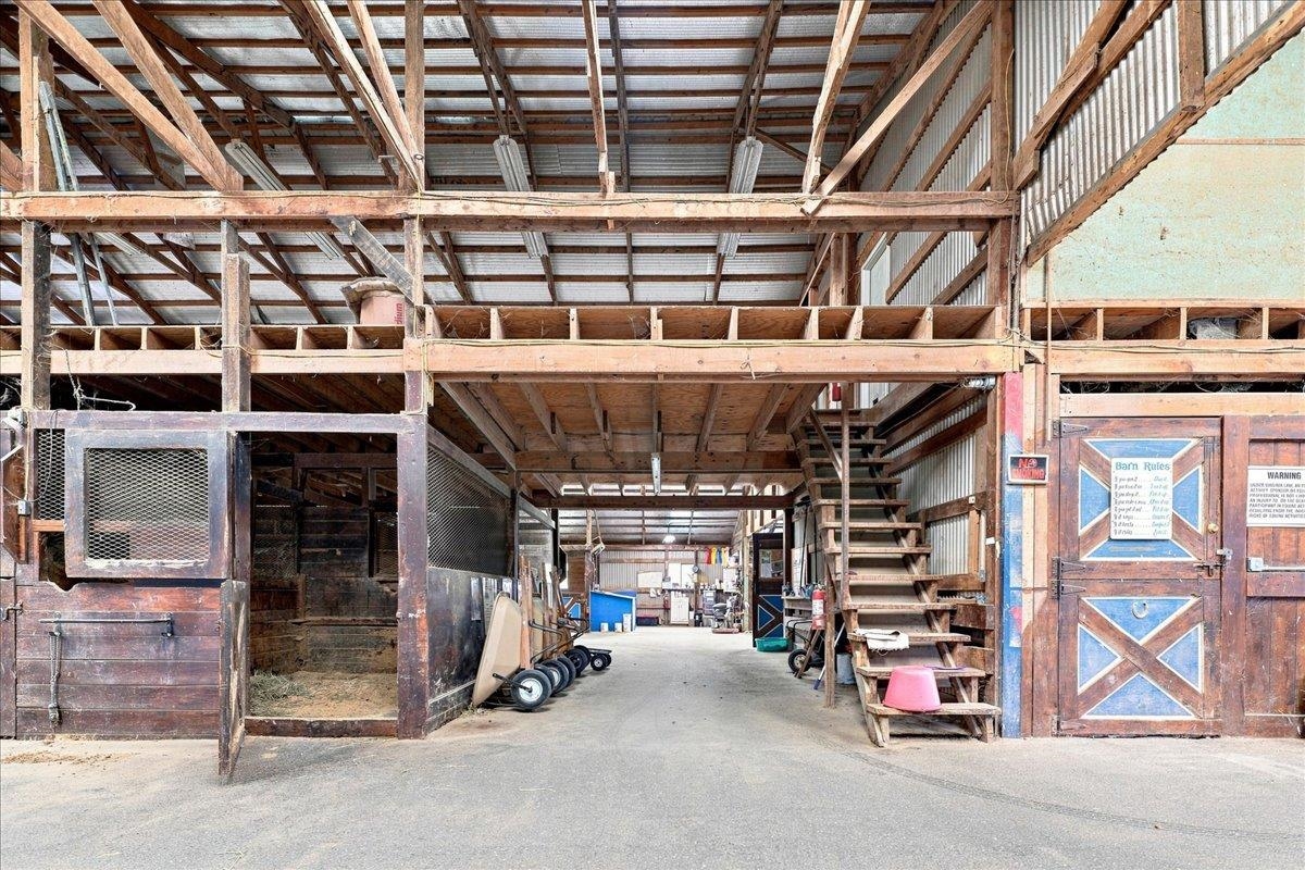 40-stall stable with wood post-and-beam construction, metal roof, rubber-matted stalls, office, laundry, bathroom, wash racks, tack rooms and loft storage. Includes a 3-bedroom apartment with kitchen, bath and living area. 40-stall stable with wood post-and-beam construction, metal roof, rubber-matted stalls, office, laundry, bathroom, wash racks, tack rooms and loft storage. Includes a 3-bedroom apartment with kitchen, bath and living area.