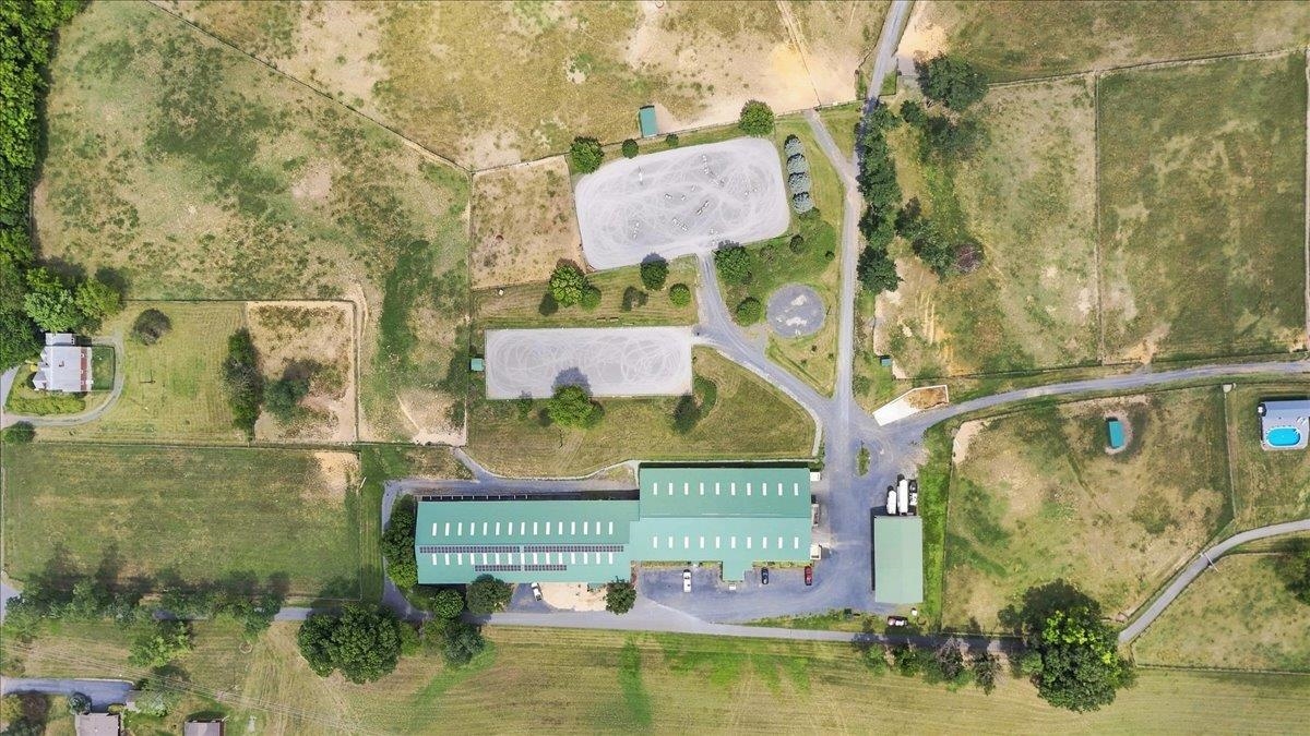 Premier Equestrian Facility on 38.76 Acres | 40-Stall Barn | 14,400 SF Indoor Arena | Dressage Ring | Jumping Ring | Cross-Country Course | Equipment Shed | Multiple Fields & Run-In Sheds | Trail-Riding Access Premier Equestrian Facility on 38.76 Acres | 40-Stall Barn | 14,400 SF Indoor Arena | Dressage Ring | Jumping Ring | Cross-Country Course | Equipment Shed | Multiple Fields & Run-In Sheds | Trail-Riding Access