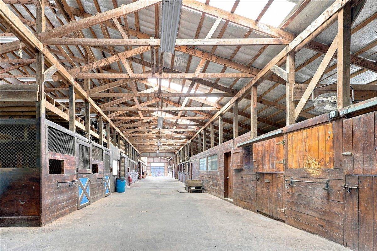 40-stall stable with wood post-and-beam construction, metal roof, rubber-matted stalls, office, laundry, bathroom, wash racks, tack rooms and loft storage. Includes a 3-bedroom apartment with kitchen, bath and living area. 40-stall stable with wood post-and-beam construction, metal roof, rubber-matted stalls, office, laundry, bathroom, wash racks, tack rooms and loft storage. Includes a 3-bedroom apartment with kitchen, bath and living area.