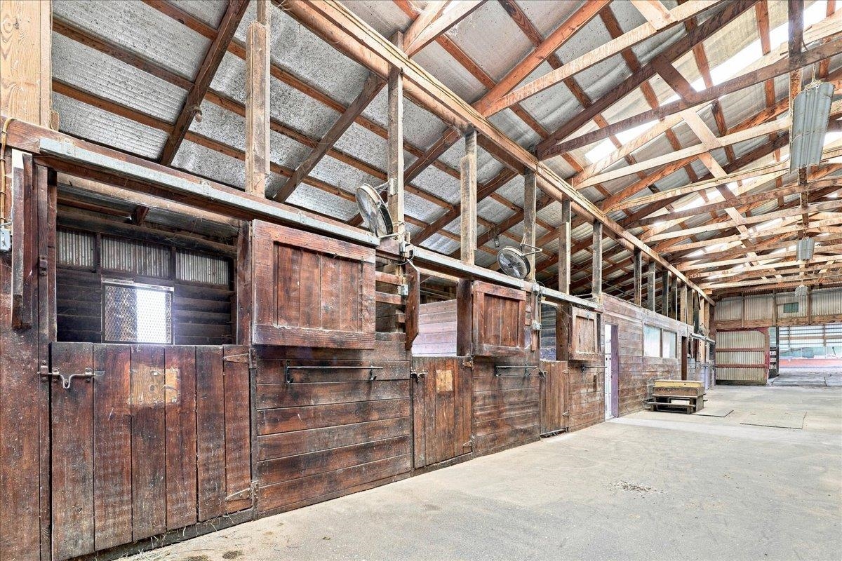 40-stall stable with wood post-and-beam construction, metal roof, rubber-matted stalls, office, laundry, bathroom, wash racks, tack rooms and loft storage. Includes a 3-bedroom apartment with kitchen, bath and living area. 40-stall stable with wood post-and-beam construction, metal roof, rubber-matted stalls, office, laundry, bathroom, wash racks, tack rooms and loft storage. Includes a 3-bedroom apartment with kitchen, bath and living area.