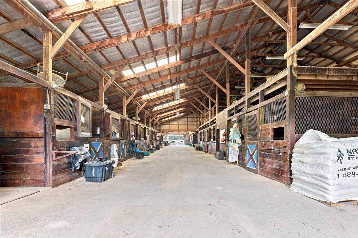 40-stall stable with wood post-and-beam construction, metal roof, rubber-matted stalls, office, laundry, bathroom, wash racks, tack rooms and loft storage. Includes a 3-bedroom apartment with kitchen, bath and living area. 40-stall stable with wood post-and-beam construction, metal roof, rubber-matted stalls, office, laundry, bathroom, wash racks, tack rooms and loft storage. Includes a 3-bedroom apartment with kitchen, bath and living area.