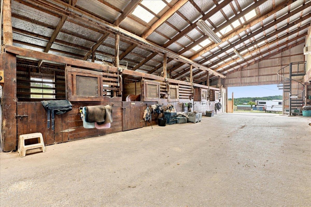 40-stall stable with wood post-and-beam construction, metal roof, rubber-matted stalls, office, laundry, bathroom, wash racks, tack rooms and loft storage. Includes a 3-bedroom apartment with kitchen, bath and living area. 40-stall stable with wood post-and-beam construction, metal roof, rubber-matted stalls, office, laundry, bathroom, wash racks, tack rooms and loft storage. Includes a 3-bedroom apartment with kitchen, bath and living area.
