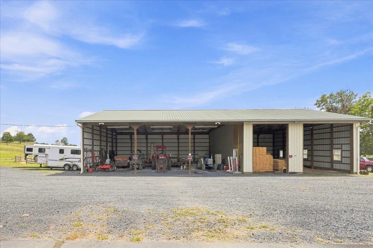64' x 40' equipment building constructed circa 2005 with wood pole construction, metal siding and roof, aluminum gutters, gravel floor, 14' ceiling height, and electric service. 64' x 40' equipment building constructed circa 2005 with wood pole construction, metal siding and roof, aluminum gutters, gravel floor, 14' ceiling height, and electric service.