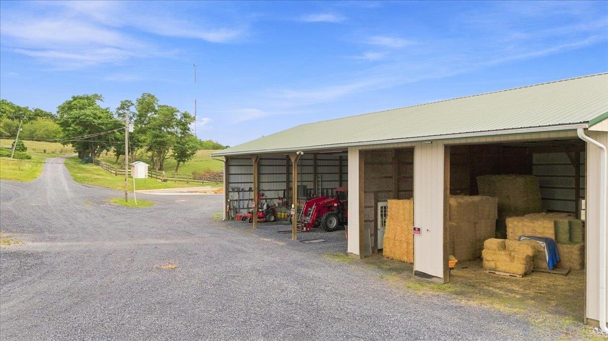 64' x 40' equipment building constructed circa 2005 with wood pole construction, metal siding and roof, aluminum gutters, gravel floor, 14' ceiling height, and electric service. 64' x 40' equipment building constructed circa 2005 with wood pole construction, metal siding and roof, aluminum gutters, gravel floor, 14' ceiling height, and electric service.