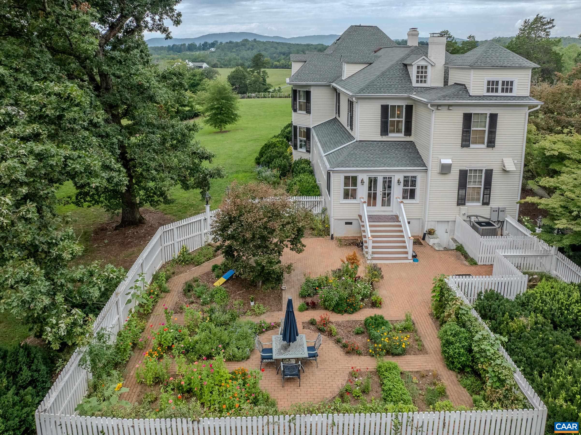 Mountain views, vineyard, gardens and pool make this an exclusive country home