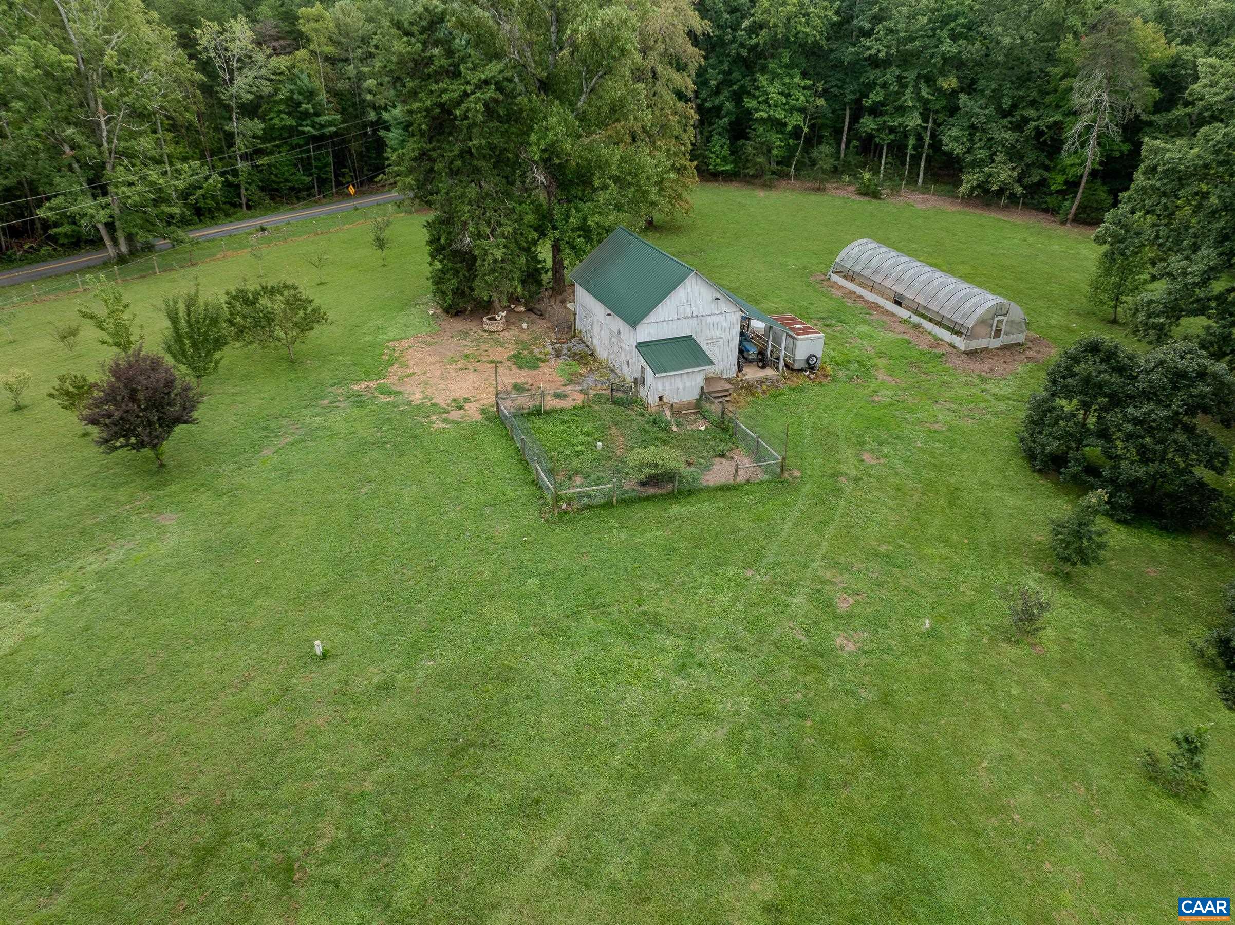 Greenhouse and barn with pigs and chickens