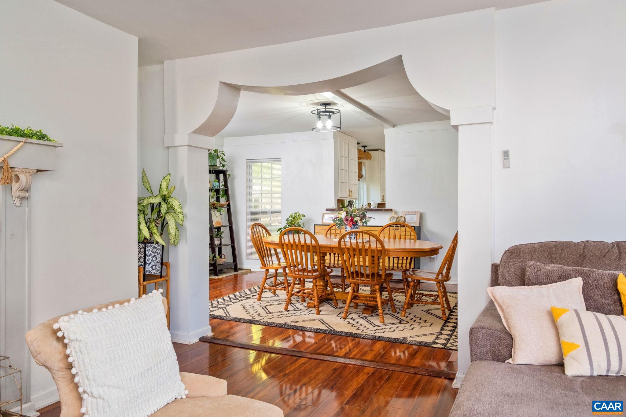 Beautiful detailed archway separates living and dining areas. Beautiful detailed archway separates living and dining areas.