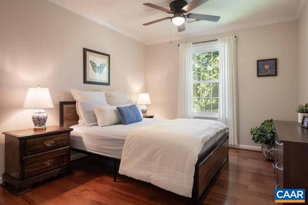 Ceiling fans with overhead lighting in bedrooms