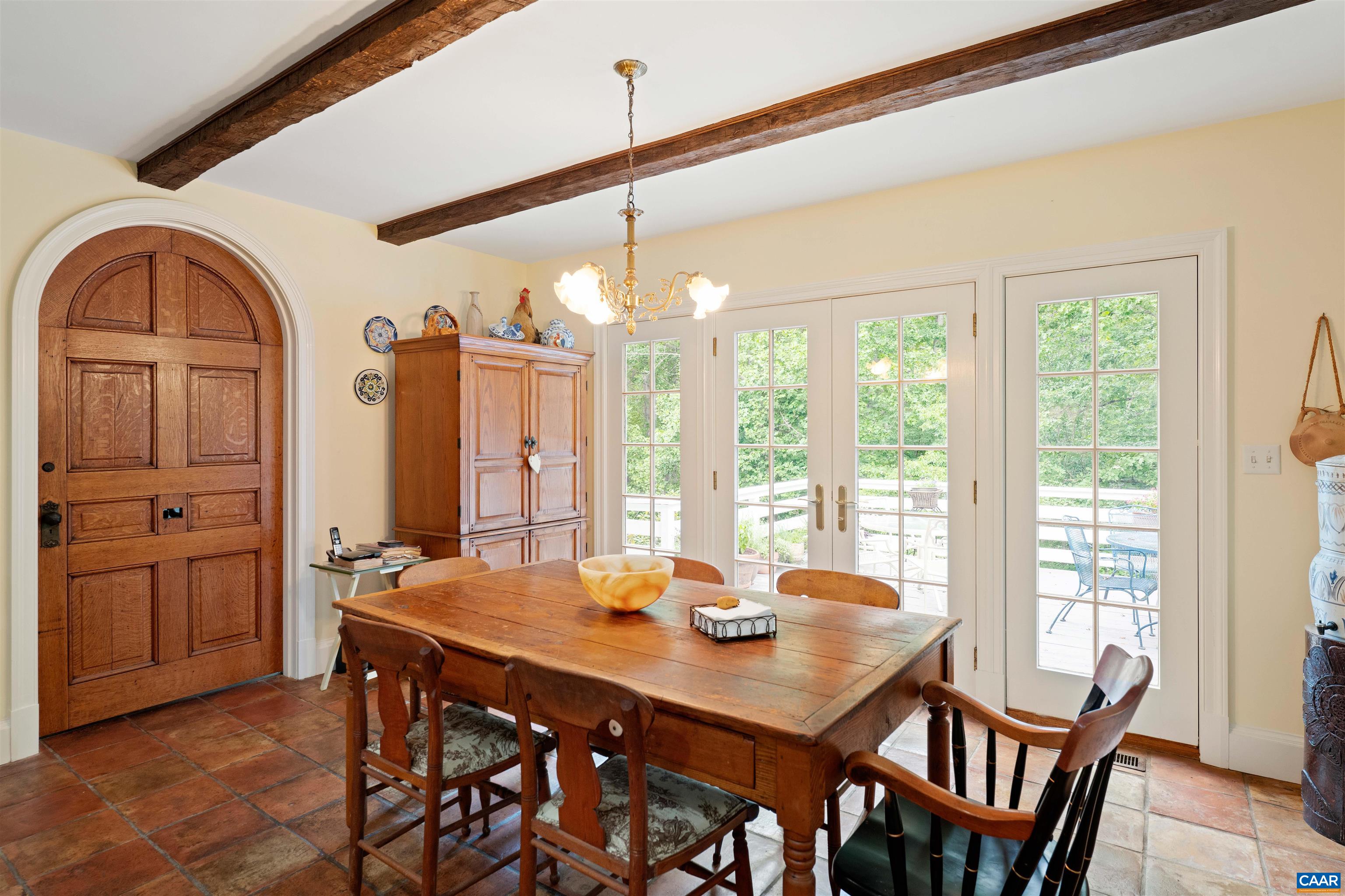 Leads to the rear deck overlooking the peacful wooded setting.