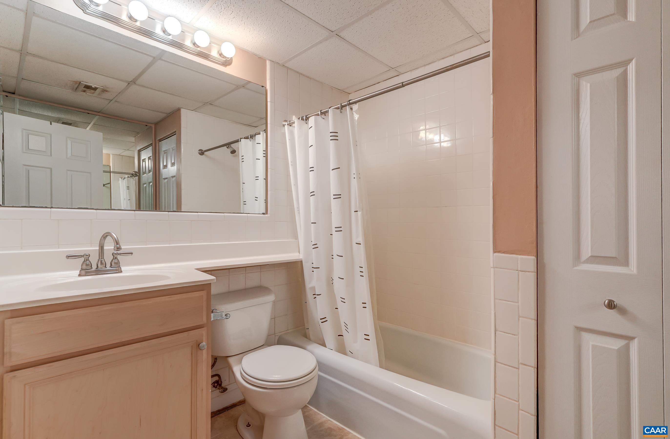 Full hall bathroom with tub/shower combo Full hall bathroom with tub/shower combo
