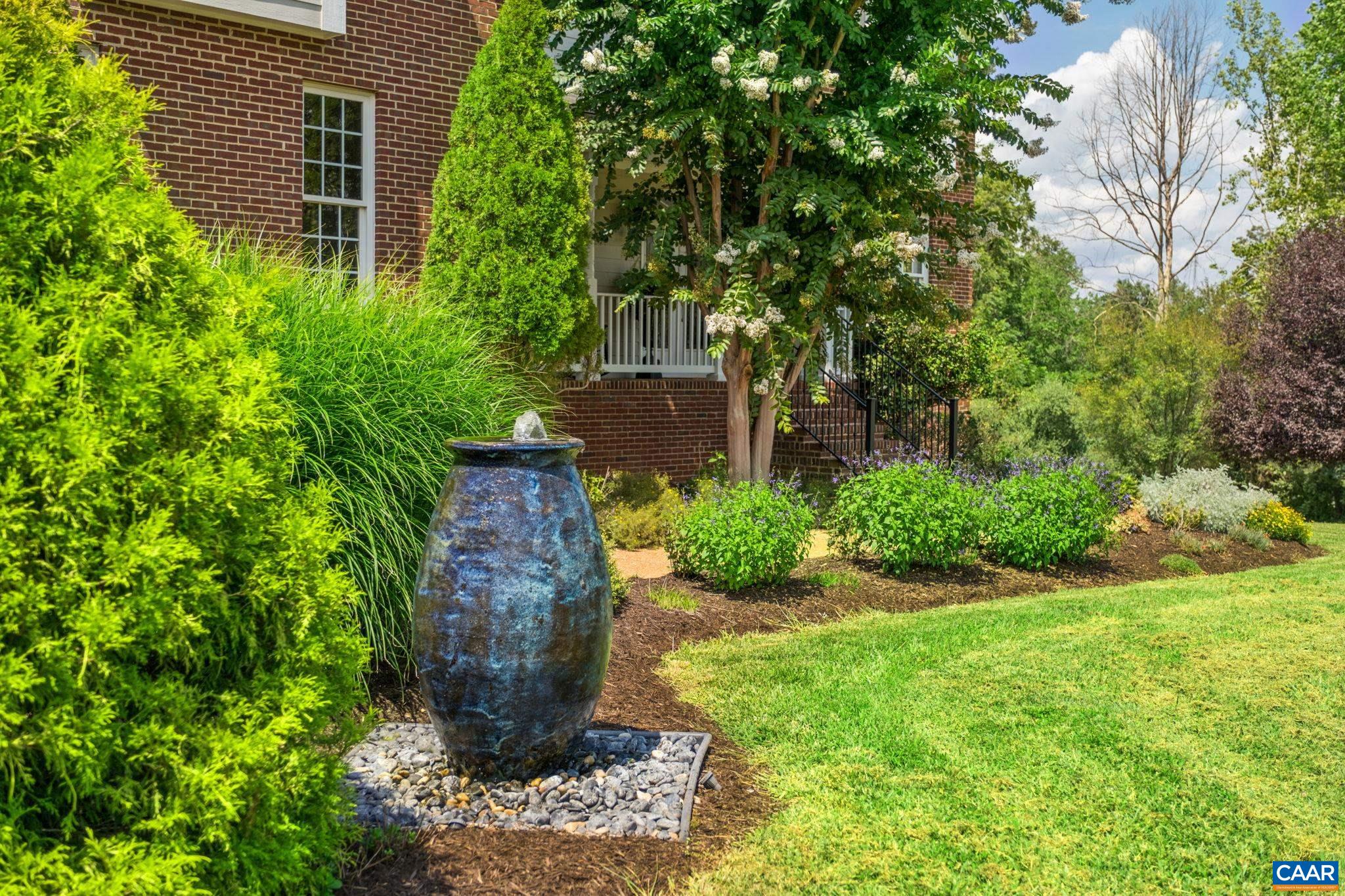 Tranquil water fountain and mature landscaping greet you at the sidewalk. Tranquil water fountain and mature landscaping greet you at the sidewalk.