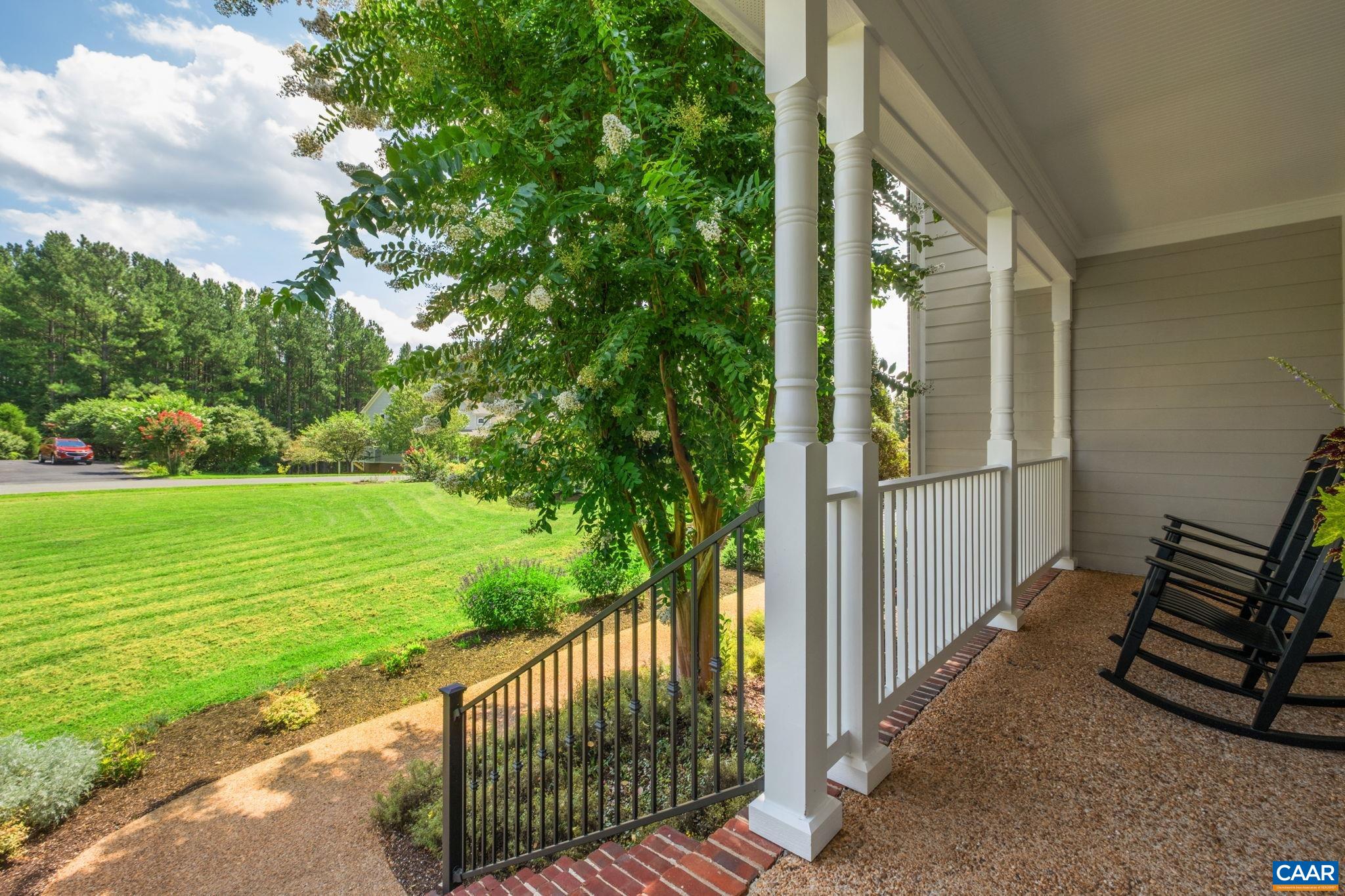 The front porch is trimmed in brick, with new metal stair railing. The front porch is trimmed in brick, with new metal stair railing.