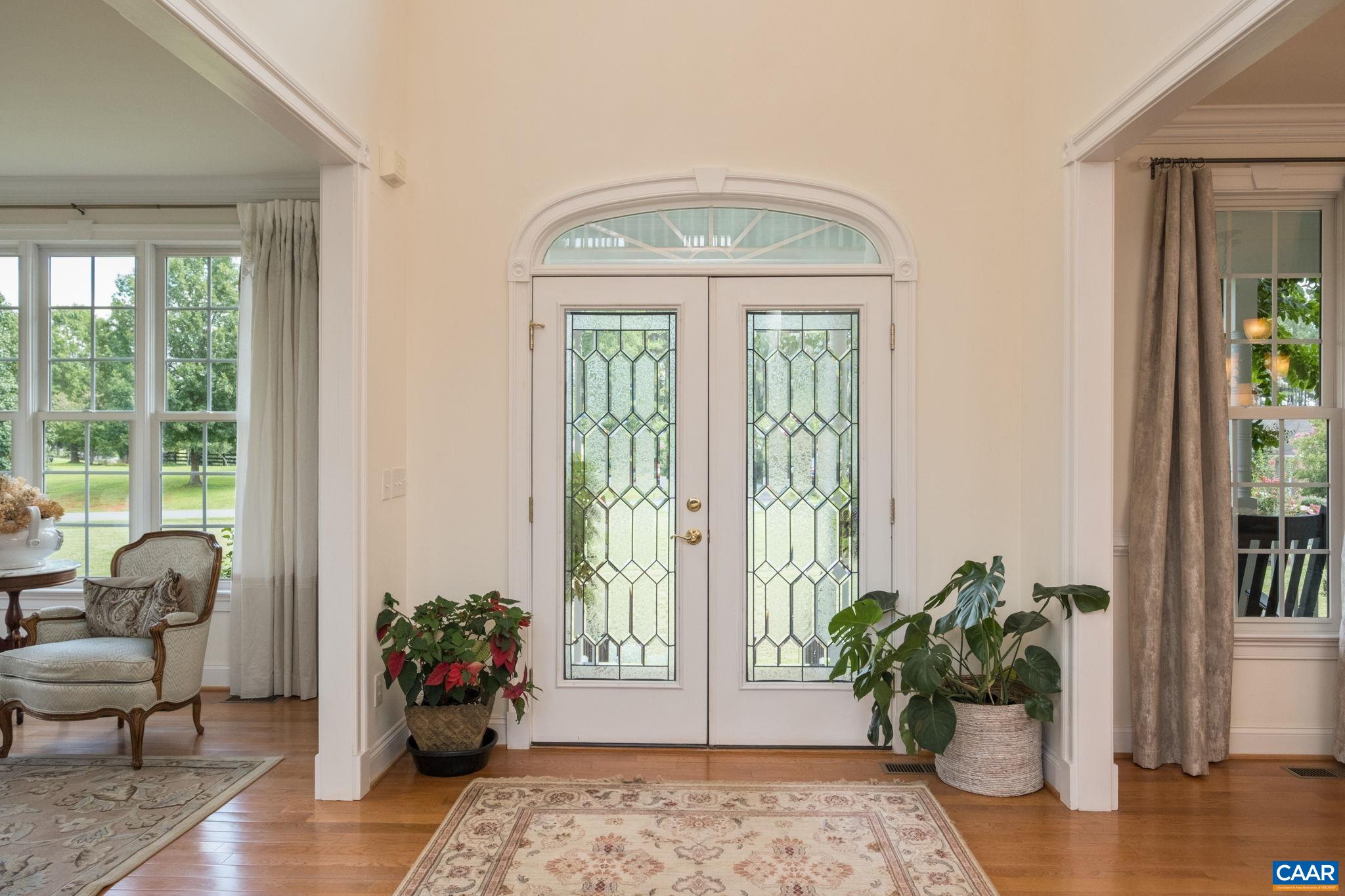 Looking at the French doors, the sitting room is to the left and the dining room is to the right. Looking at the French doors, the sitting room is to the left and the dining room is to the right.