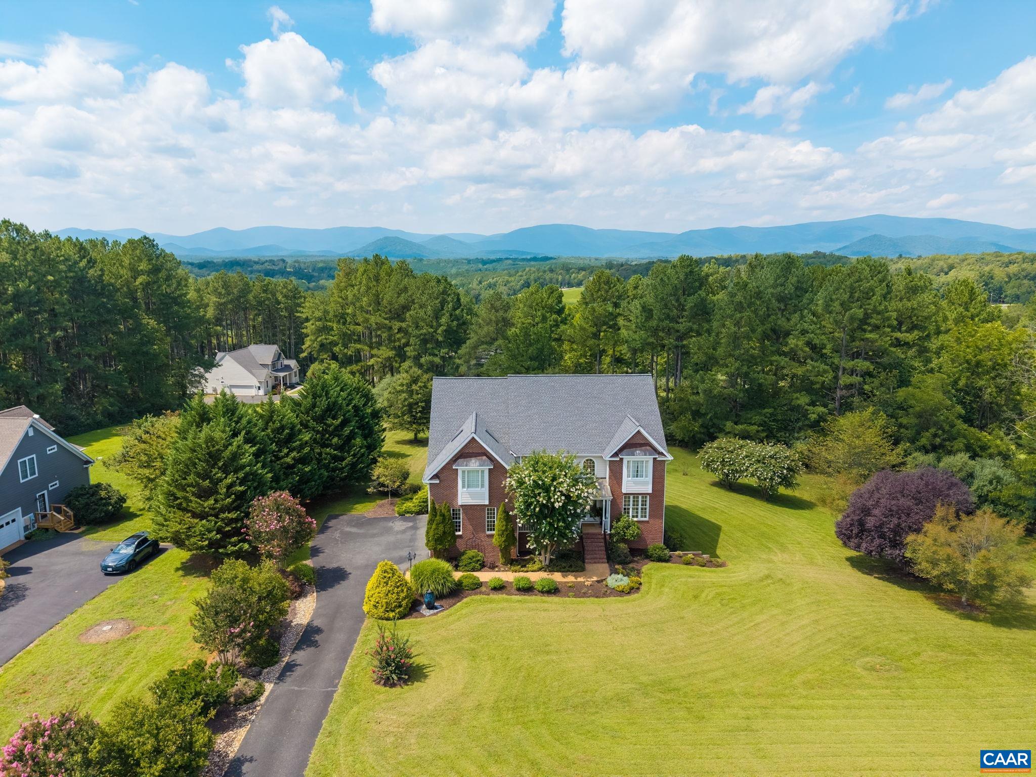 Mountain views are visible from the property, and mature landscaping offers some privacy. Mountain views are visible from the property, and mature landscaping offers some privacy.