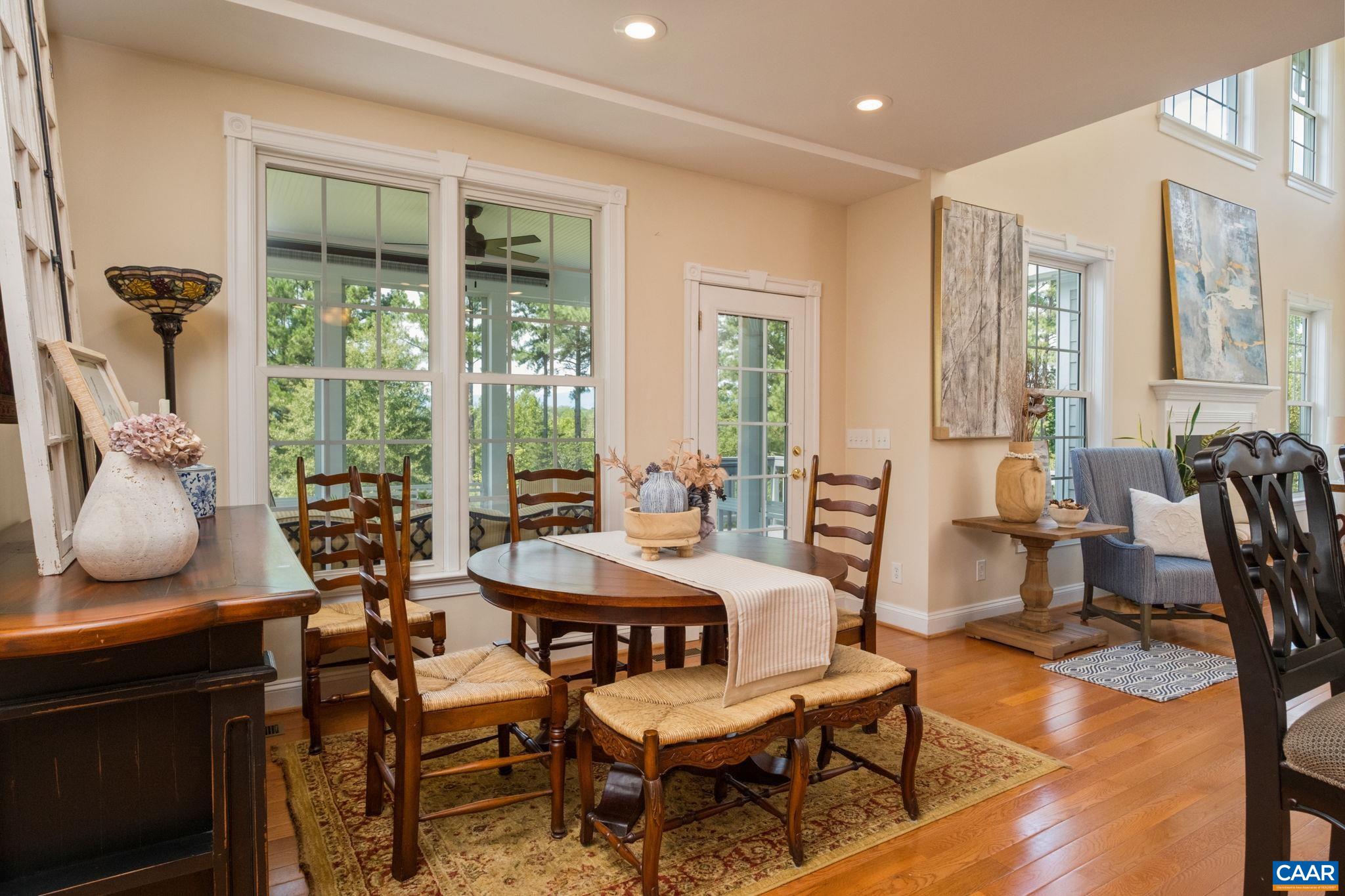 Enjoy sitting at the breakfast nook with views of the mountains. Windows have lovely trim. From the camera view, the back hallway (not in view) leads to the full bathroom, a main level bedroom, laundry, and garage. Enjoy sitting at the breakfast nook with views of the mountains. Windows have lovely trim. From the camera view, the back hallway (not in view) leads to the full bathroom, a main level bedroom, laundry, and garage.