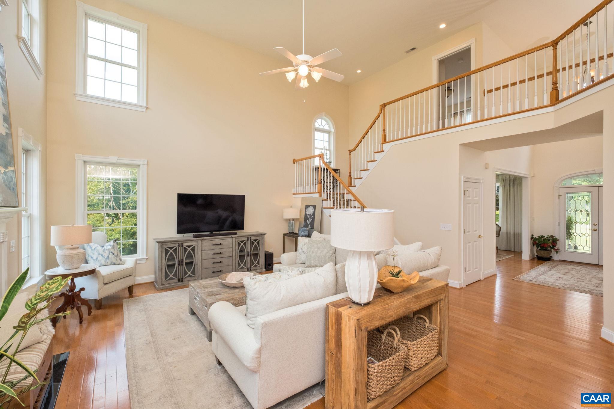 The great room is spacious and bright, and is open to the winding staircase. The great room is spacious and bright, and is open to the winding staircase.