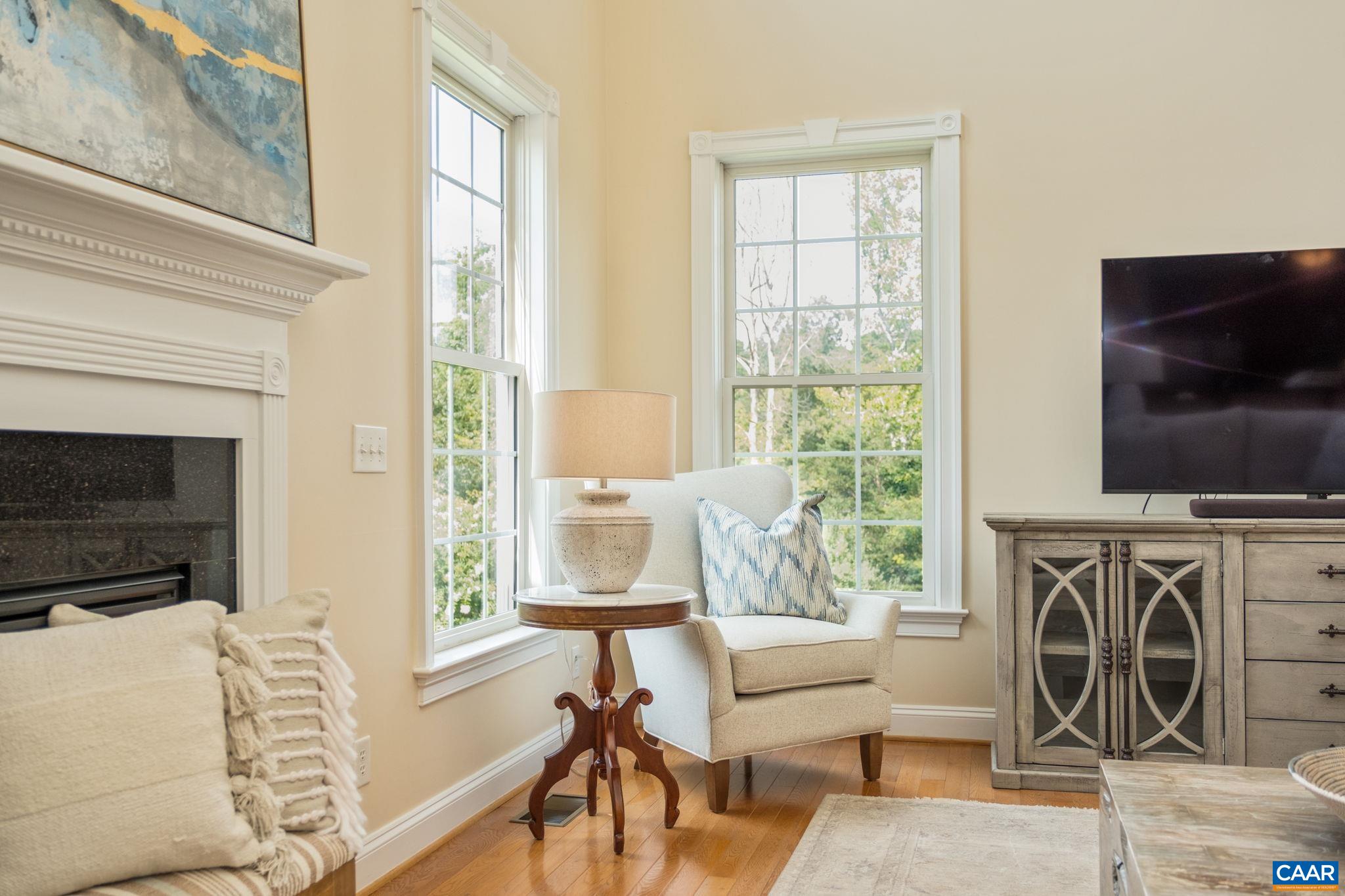 The fireplace surround and windows feature lovely detail. The fireplace surround and windows feature lovely detail.