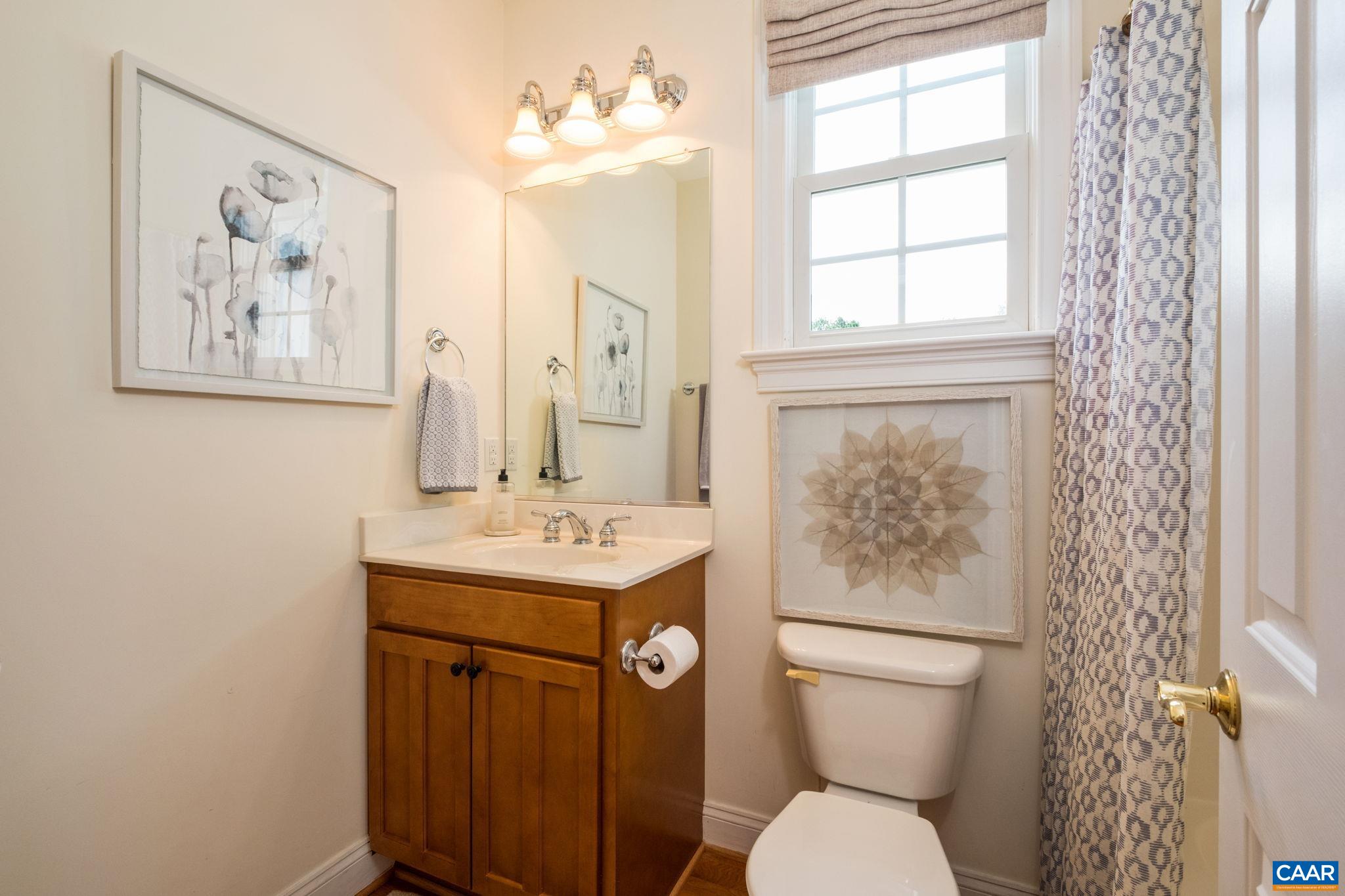 This bathroom is adjacent to the main level bedroom, just off of the kitchen and laundry area. This bathroom is adjacent to the main level bedroom, just off of the kitchen and laundry area.