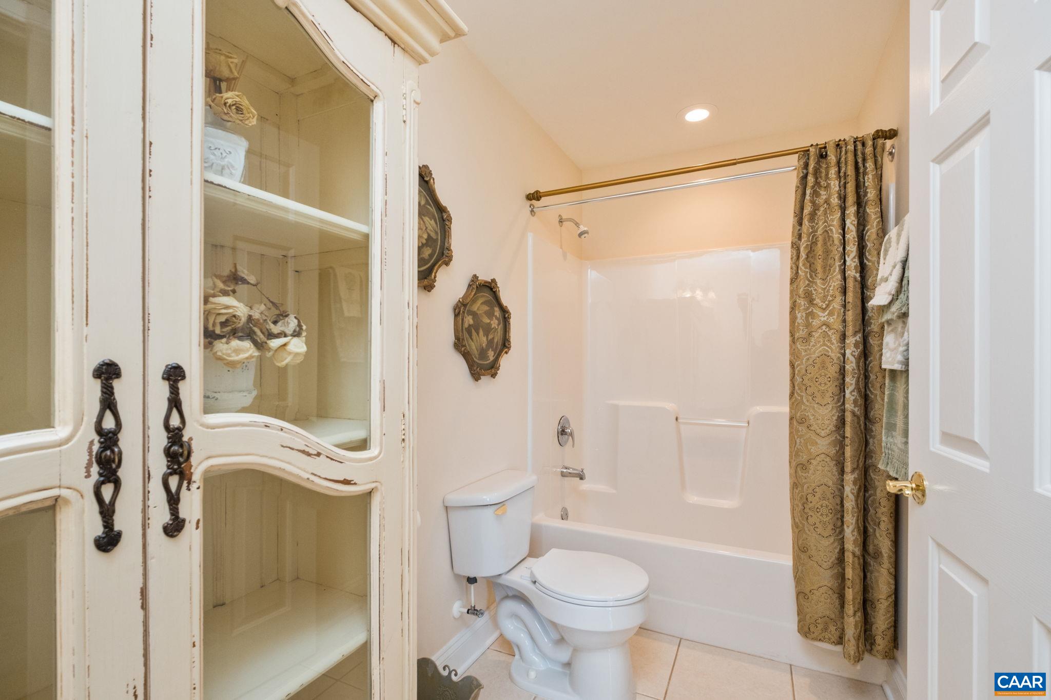 Out of camera view is the sink for this second primary bathroom. Out of camera view is the sink for this second primary bathroom.