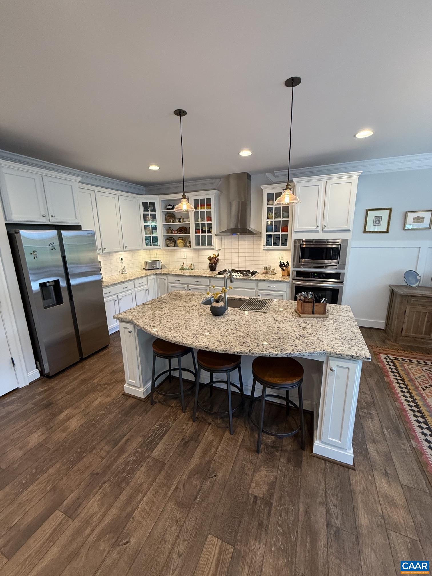 Samsung refrigerator, Bosch dishwasher, gas stove top, oven, microwave, granite island and counter tops, tile backsplash. Samsung refrigerator, Bosch dishwasher, gas stove top, oven, microwave, granite island and counter tops, tile backsplash.