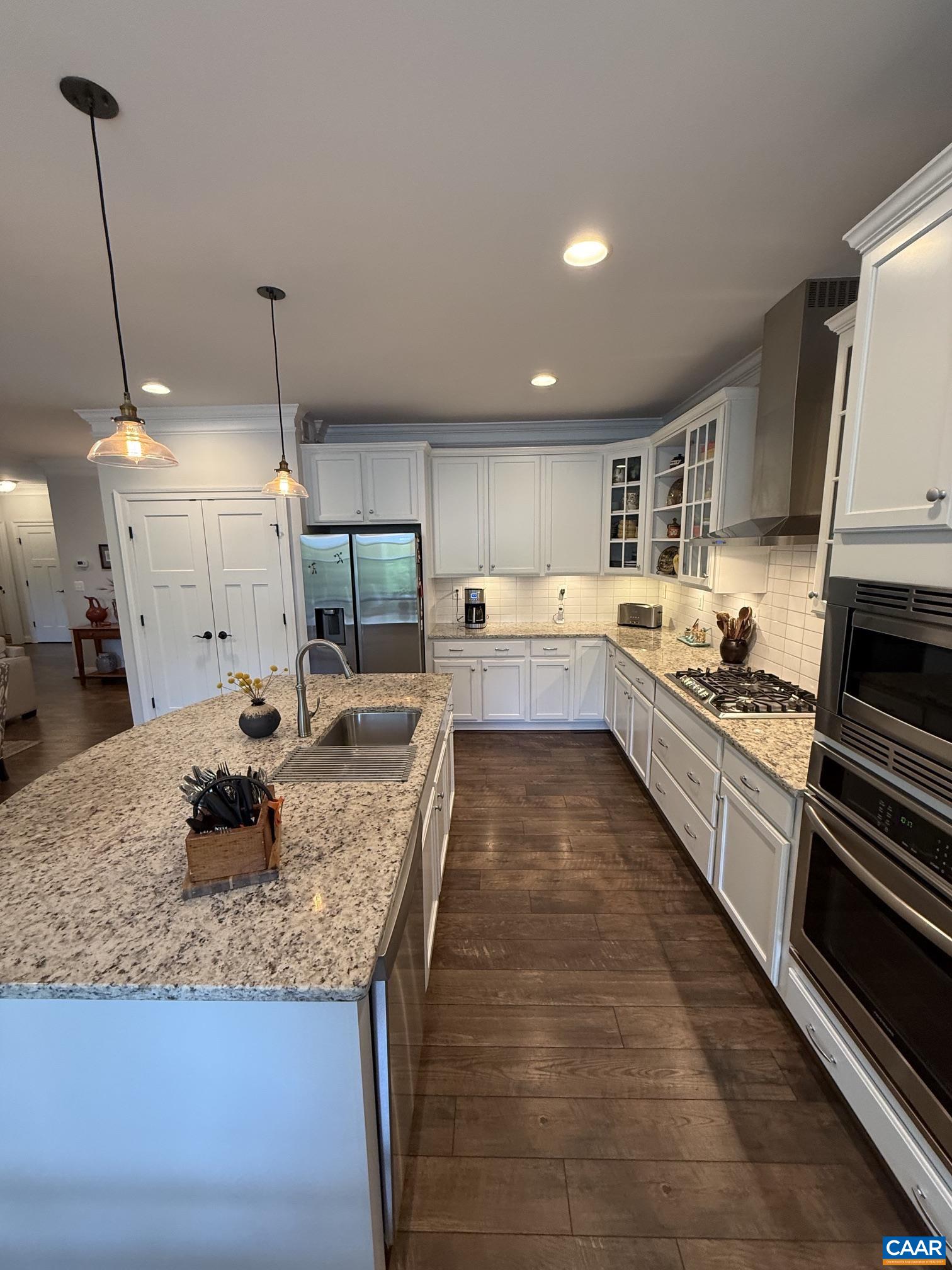 Samsung refrigerator, Bosch dishwasher, gas stove top, oven, microwave, granite island and counter tops, tile backsplash. Samsung refrigerator, Bosch dishwasher, gas stove top, oven, microwave, granite island and counter tops, tile backsplash.