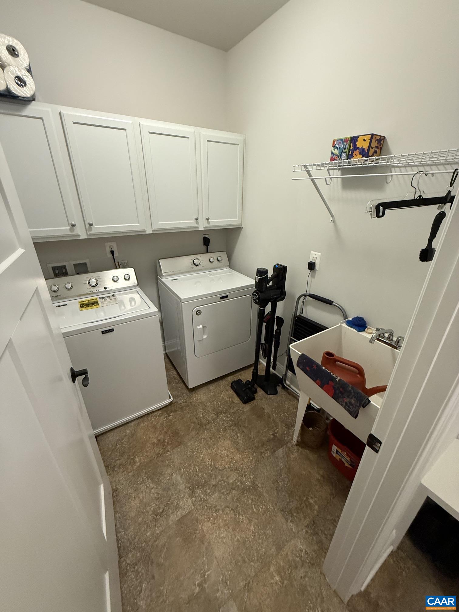 Maytag washer and dryer, cabinets and utility sink. Maytag washer and dryer, cabinets and utility sink.