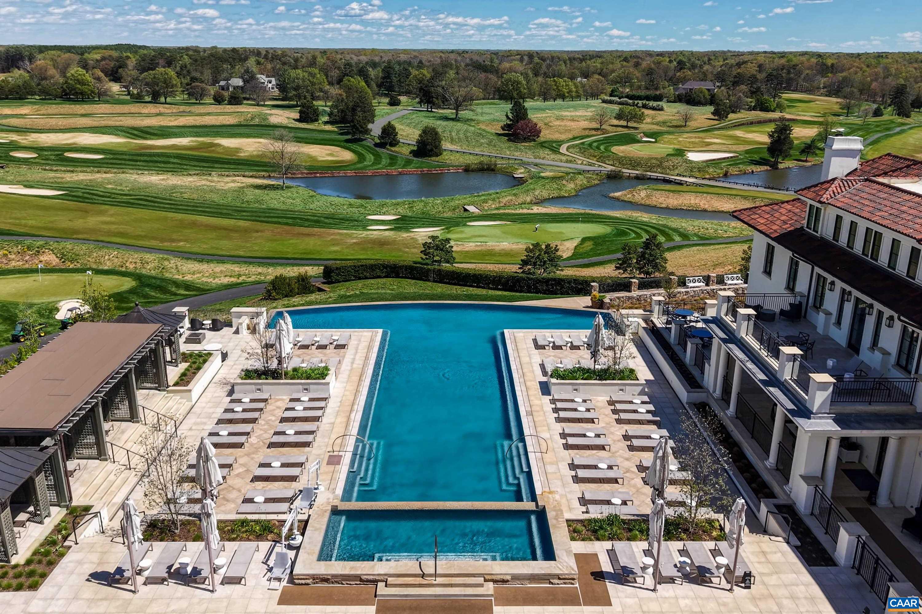 Infinity pool & cabanas, view of the Full Cry links-style championship golf course designed by Pete Dye. Infinity pool & cabanas, view of the Full Cry links-style championship golf course designed by Pete Dye.