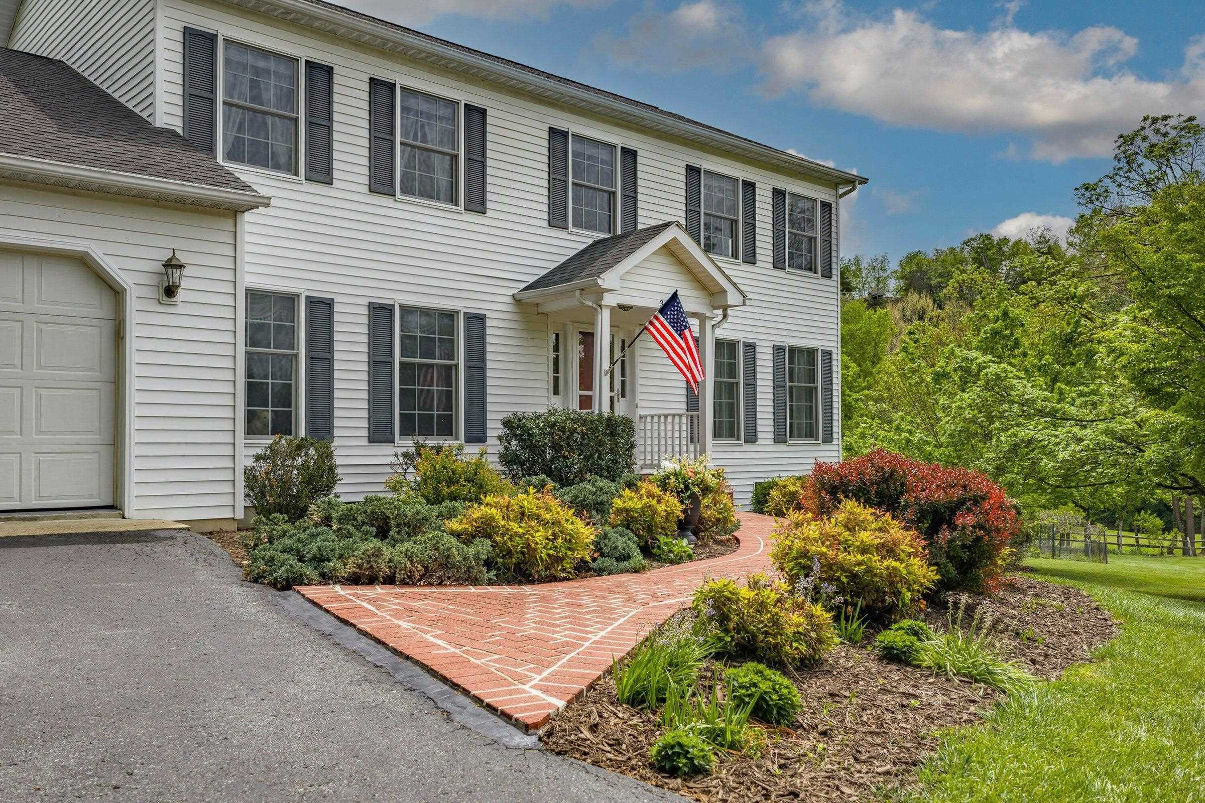 Lovely brick walk-way leads to the front entrance. Lovely brick walk-way leads to the front entrance.