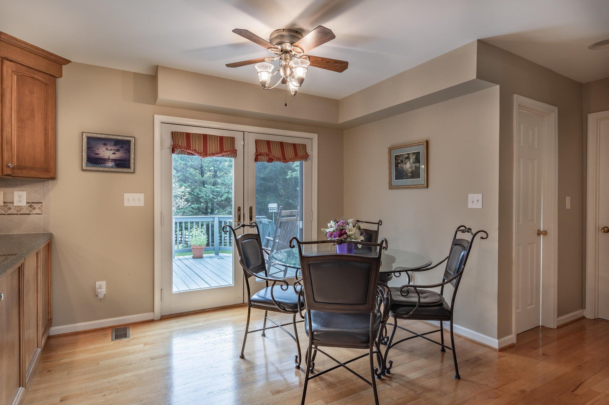 French doors lead from the eat-in kitchen to the rear porch. French doors lead from the eat-in kitchen to the rear porch.