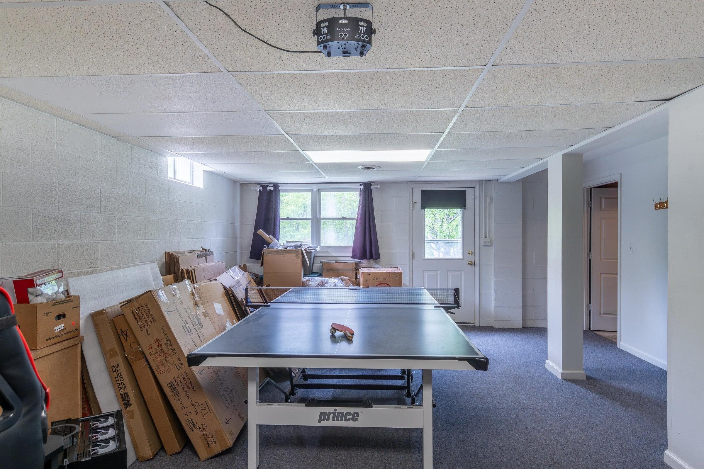 The basement exits out to the surrounding lawns. The basement exits out to the surrounding lawns.