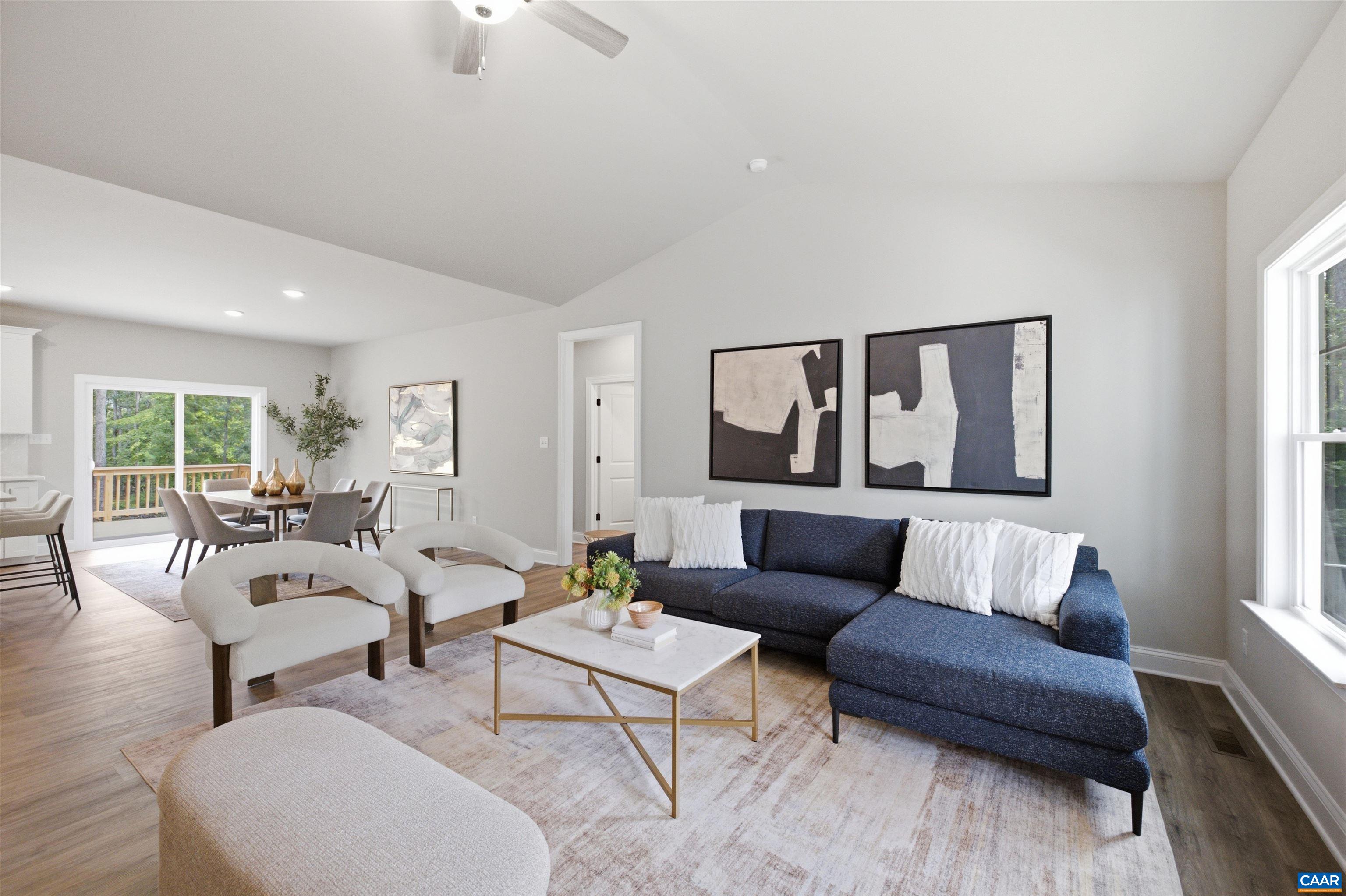 Views to the dining area and kitchen. Photo of a staged home. Views to the dining area and kitchen. Photo of a staged home.