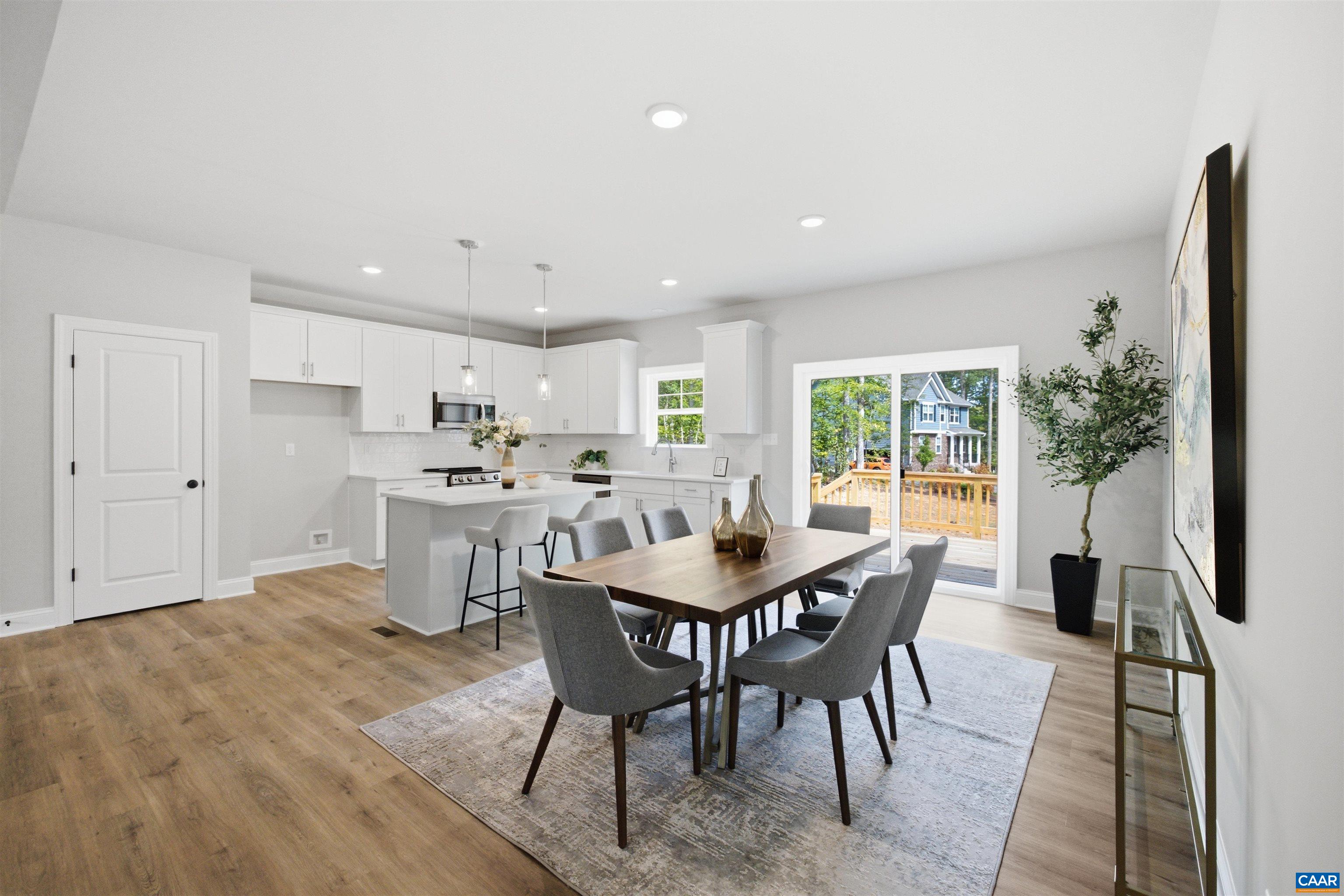Kitchen has walk-in pantry, SS dishwasher, stove and microwave. Lots of light! Photo of a staged home. Kitchen has walk-in pantry, SS dishwasher, stove and microwave. Lots of light! Photo of a staged home.