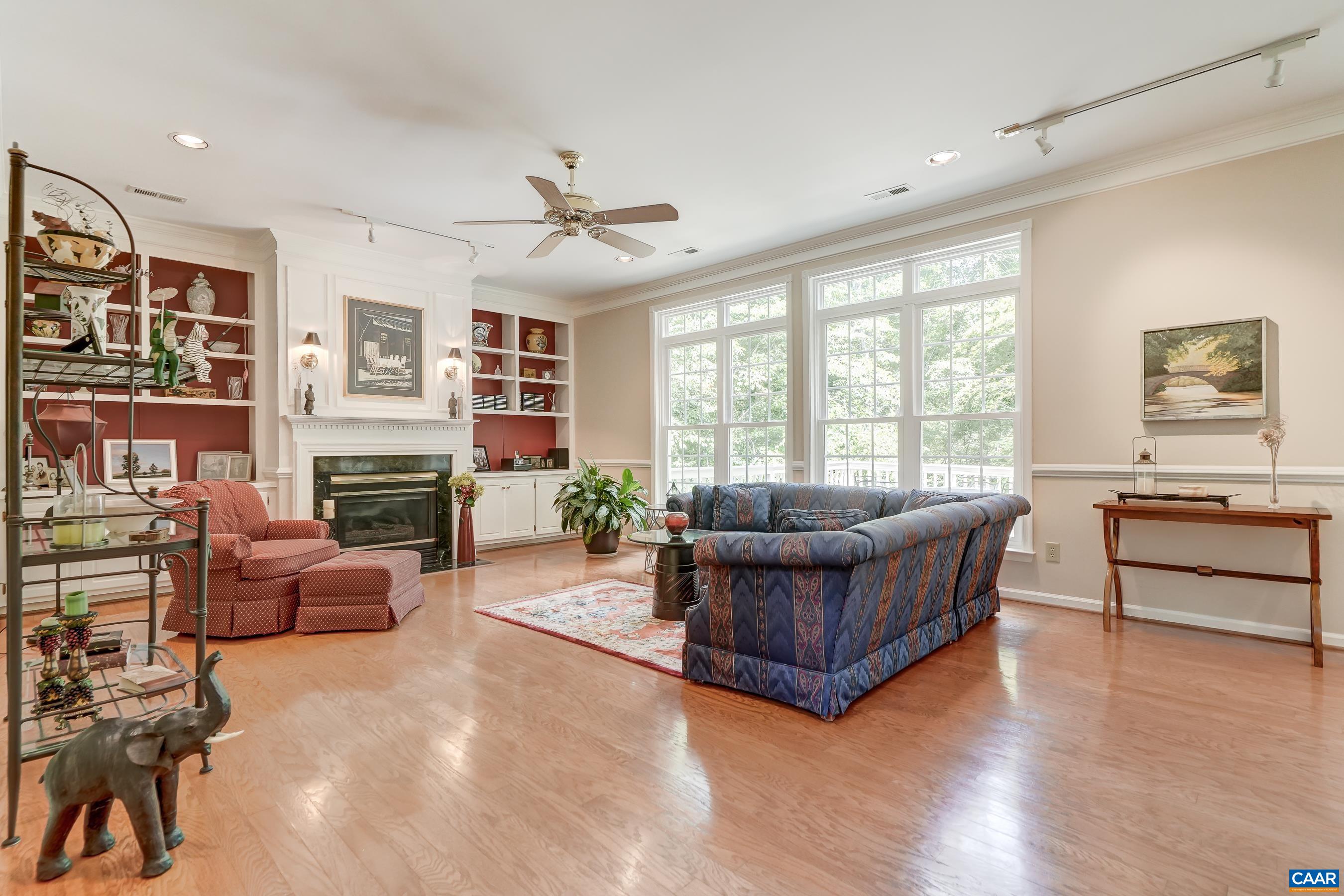 Light-filled great room features gas fireplace with built-ins. Light-filled great room features gas fireplace with built-ins.