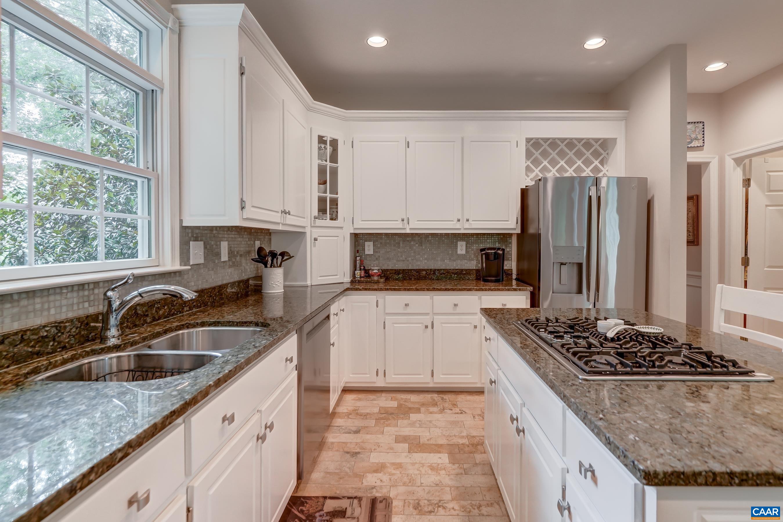 Granite counters and travertine floors provide elegance and style. Granite counters and travertine floors provide elegance and style.