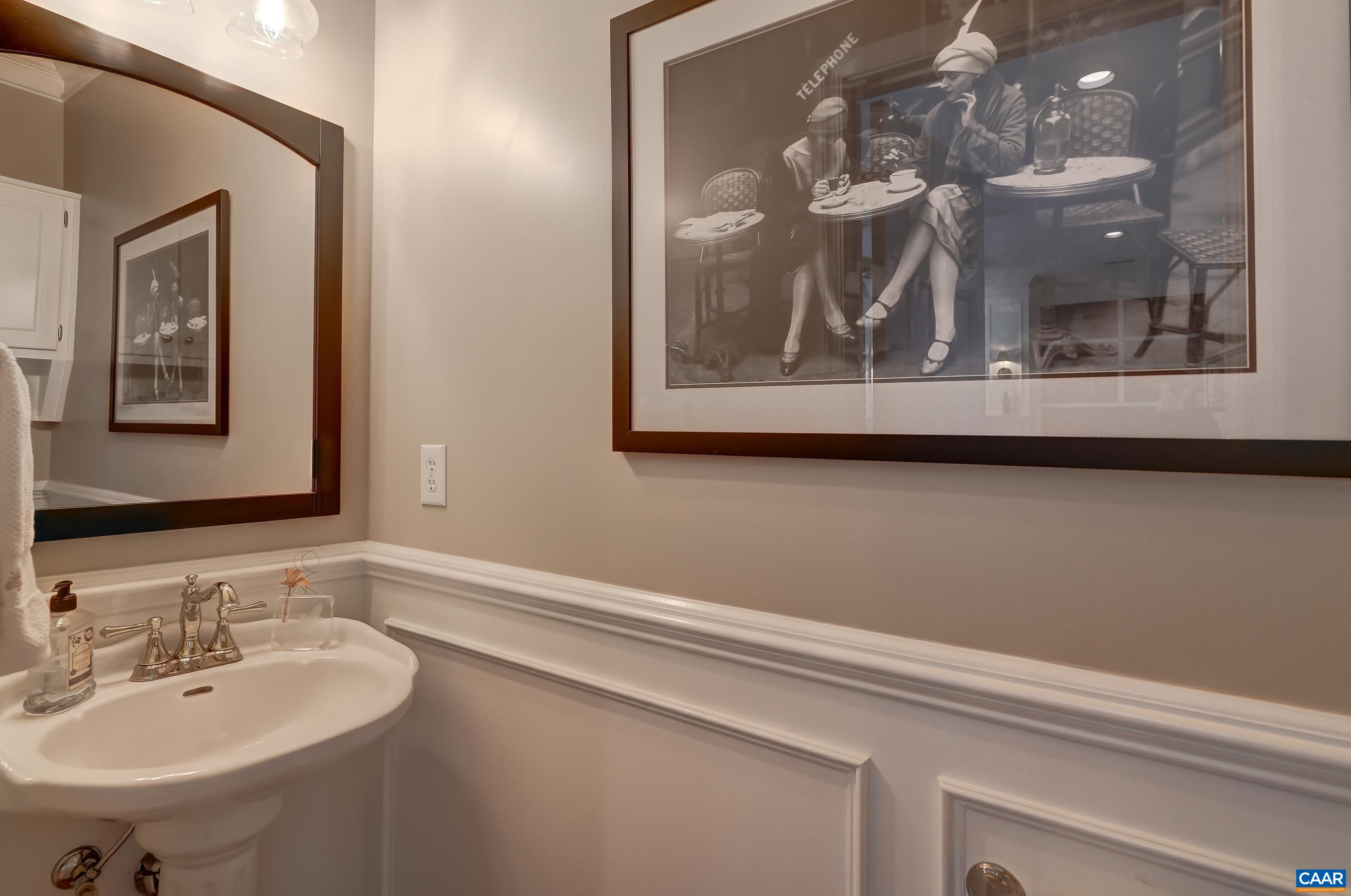 Half bath with wainscoting. Half bath with wainscoting.
